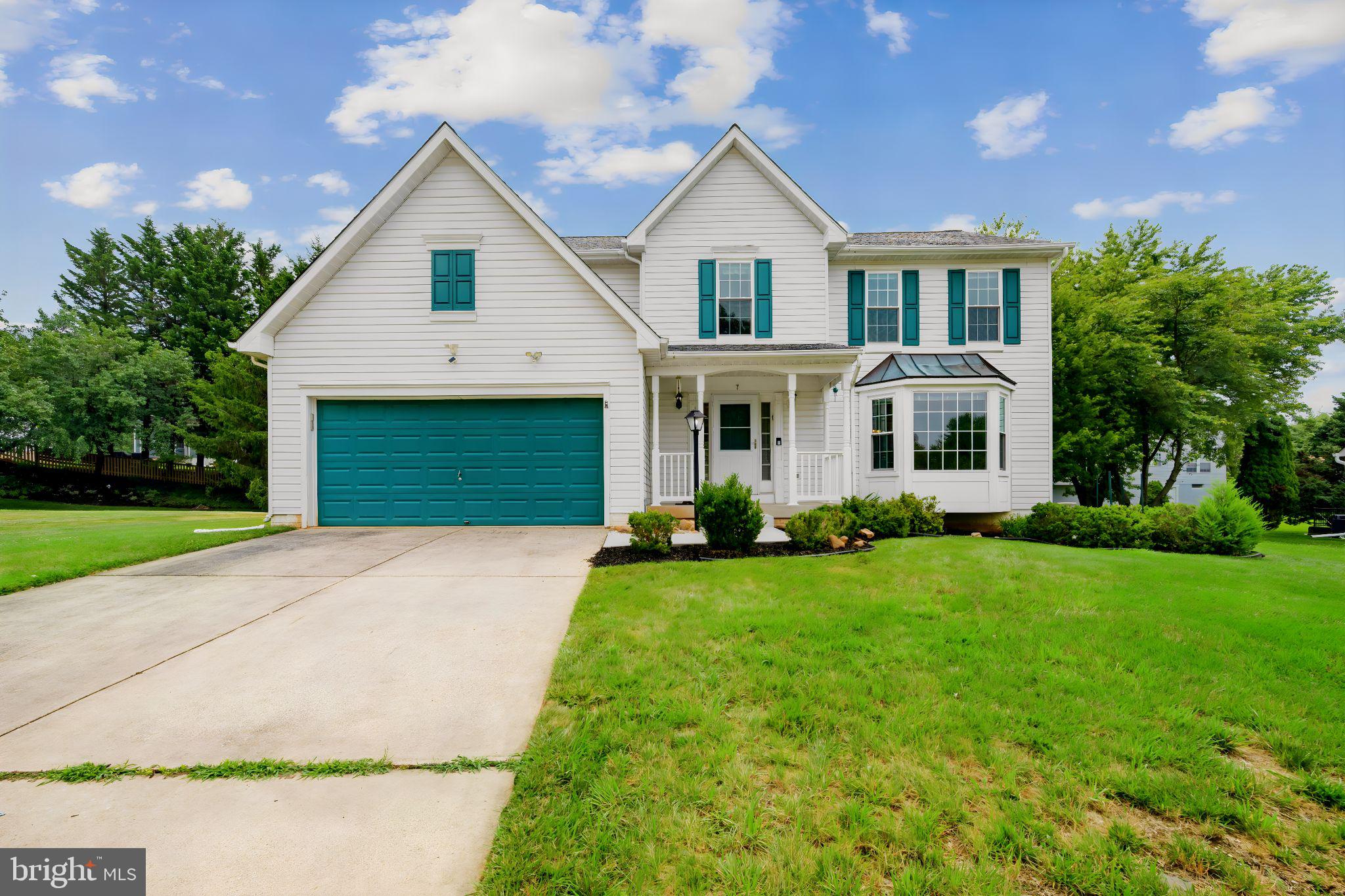 Welcome to 7 Raindrop Circle, nestled on a picturesque circle in the heart of Reisterstown. This beautifully maintained 4-bedroom, 2.5-bath colonial with a two-car attached garage offers the perfect combination of comfort, style, and space.

The main level features beautiful hardwood flooring throughout, a sun-filled formal living room wth a bay window and a spacious dining room with a large window. providing lots of natural light. The kitchen is complete with quartz countertops, tall cabinetry, a breakfast bar, and a bright breakfast area leading to the freshly painted deck overlooking peaceful, private surroundings. Just off the kitchen, the inviting family room provides the perfect space for relaxing or entertaining.

Upstairs, you'll find four generously sized bedrooms, hardwood flooring in the hallway, convenient upper-level laundry, and a spacious primary suite featuring a large walk-in closet and a beautifully renovated en-suite bath with a walk-in shower.

The expansive unfinished basement  with a bathroom rough in offers incredible potential for future living space, a home gym, recreation room, or abundant storage.

Conveniently located near shopping, restaurants, parks, and commuter routes, this move-in ready home offers the space, setting, and location you've been searching for. Don't miss your opportunity to make 7 Raindrop Circle your next home!