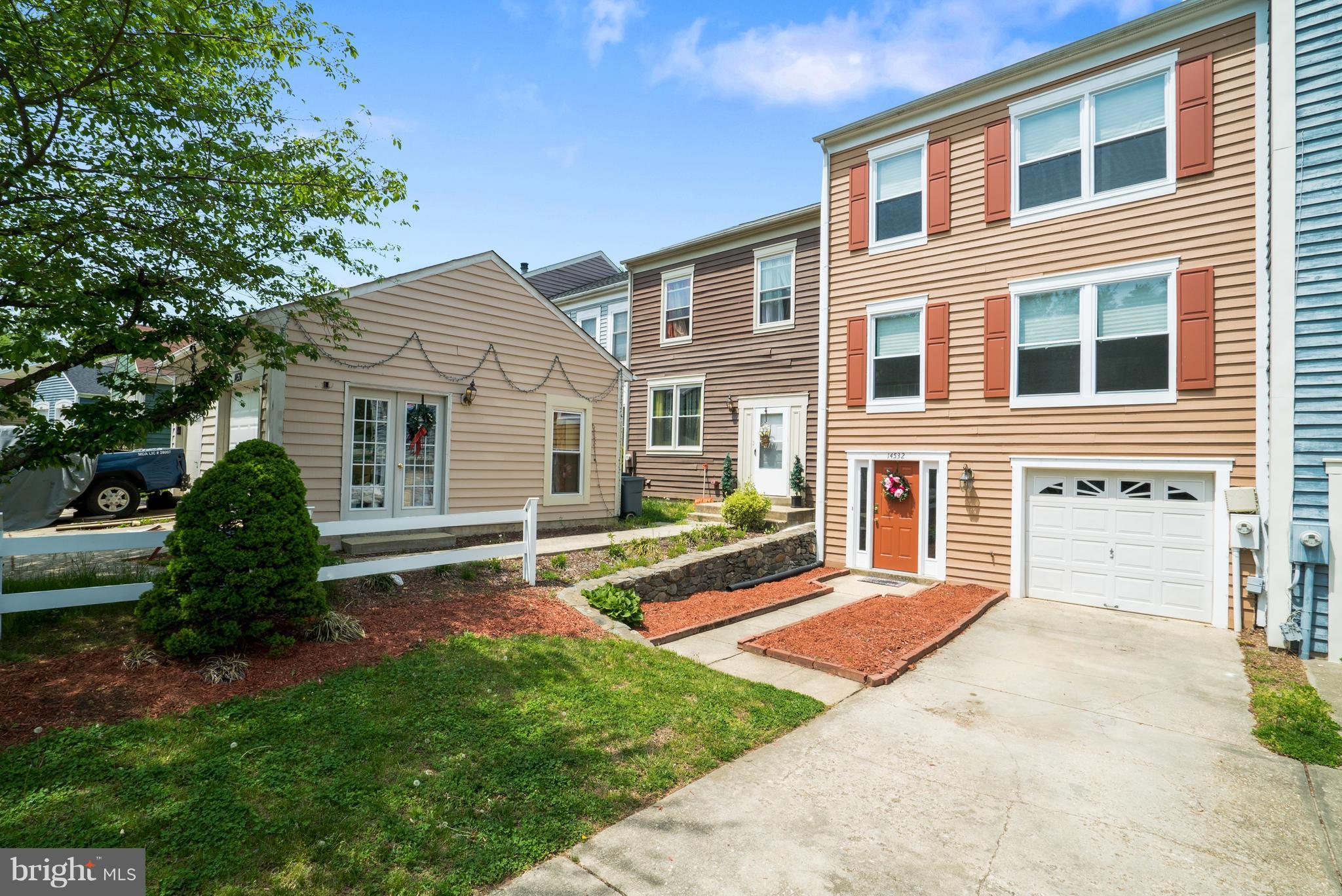 Gorgeous sunlit, immaculate, move in ready garage TH. Loads of space & features: Spacious master bedroom w/WIC & private bath. Versatile walk out LL with wood fireplace, wet bar, slider to brick patio w/night mood lighting & family room / pot 4th BR? Fresh paint, carpet & new windows. Hot water heater less than 3 years old. Backs to trees. Garage space. Quiet area with fast ICC/I-95 access.