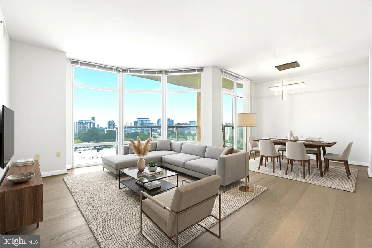 ​Perched on the 14th floor, this beautiful corner condo at Midtown Bethesda North offers the perfect blend of style, comfort, and convenience. With two bedrooms, two bathrooms, and South East-facing views, the home is filled with natural light from floor-to-ceiling windows that showcase sweeping, unobstructed views of the surrounding area. Inside, you'll find wood floors throughout the main living spaces, modern lighting, and a clean, move-in ready interior. The spacious corner layout provides added privacy, while the balcony is the perfect spot to enjoy your morning coffee or unwind at the end of the day. Two reserved parking spaces make everyday living even more convenient. 
Living here means more than just owning a beautiful home—it's enjoying a lifestyle. Residents have access to exceptional amenities, including a rooftop pool, fitness center, sky lounge, BBQ grills, movie theater, billiards room, business center, guest suite, meeting room, and the convenience of a 24/7 concierge. The condo fee also includes gas, water, and access to all of the community's amenities.