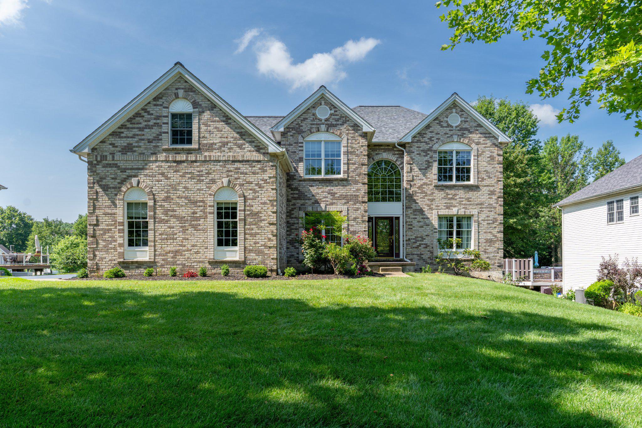 Welcome to this beautifully maintained 4-bedroom, 3.5-bath Colonial located in the highly desirable Red Lion Chase community within the Appoquinimink School District. Offering approximately 3,450 square feet of living space, with its impressive stone front exterior and well maintained landscaping, this home delivers exceptional curb appeal while combining classic design with thoughtful upgrades and modern convenience.

A dramatic curved staircase and impressive two story foyer set the tone, highlighted by a chandelier equipped with an automated lowering system for easy maintenance! The main level features gleaming hardwood floors, crown molding, recessed lighting, and a built-in speaker system throughout the main living areas.

The spacious family room flows seamlessly into the gourmet kitchen which includes a commercial grade six burner gas range as well as a matching exhaust hood, wall oven, built in microwave, large center island, and abundant cabinetry.

The primary suite offers a large walk in closet with duel built-ins and an en-suite bath with a jetted soaking tub, separate walk in shower, and dual vanities. Three additional bedrooms include a shared hall bath connecting two of the rooms, while the third bedroom enjoys a private en-suite full bath, providing comfort and flexibility.

Recent updates include a brand new roof installed in 2025, offering significant long term value and one less major expense for the next owner.

The expansive unfinished basement includes a bathroom rough-in and offers excellent potential for future finished living space such as a recreation room, gym, theater, or additional bedrooms.

Outside, enjoy an elevated lot overlooking the neighborhood with a large deck designed for entertaining. The property also features professional landscaping, an irrigation system, a security system, tankless hot water, exterior lighting, and wheelchair accessible considerations.

An oversized three car attached garage provides ample parking and storage.

Residents of Red Lion Chase enjoy community amenities including a neighborhood pool, tennis and basketball courts while remaining conveniently located near shopping, dining, and major commuter routes.

This home offers space, updates, and a highly desirable location!