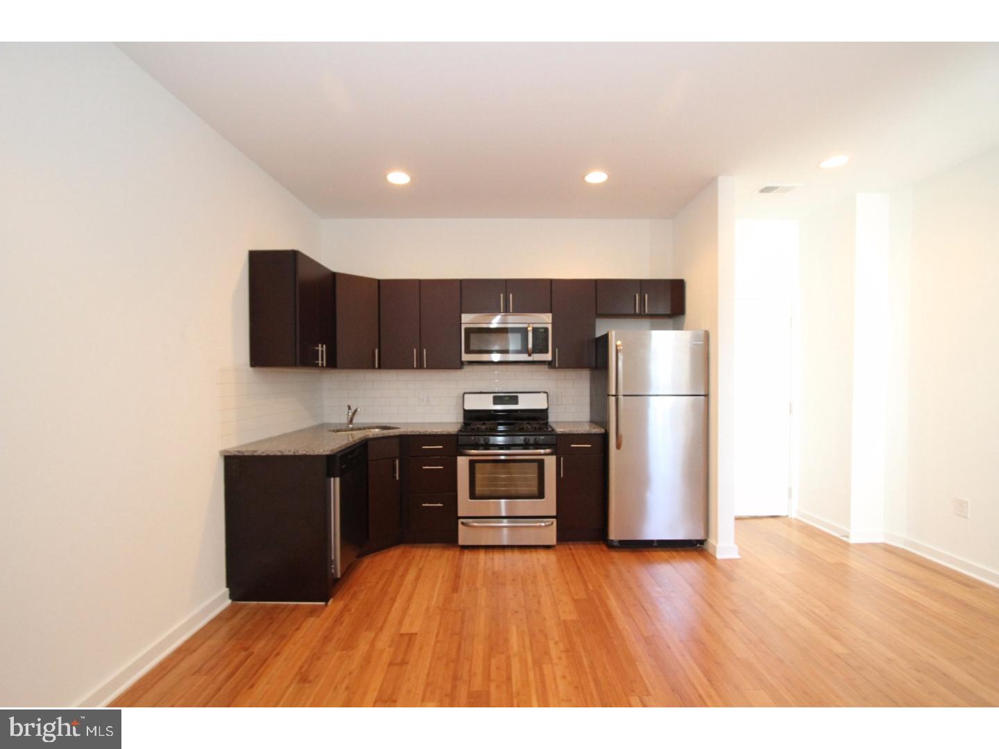 This 1 Bedroom 1 Bathroom unit is apart of a significant renovation project in one of Philadelphia's most established neighborhoods, Port Richmond. This apartment is positioned in a building with 7 total apartments, from 1 bed to 3 beds each, and is anchored by River Wards Cafe, a locally owned and operated coffee shop on the first floor. The amenities for the building include high ceilings, a focus on natural light, exposed brick, sustainable bamboo hardwood flooring, granite counter tops, ceramic tile bathrooms, 4 appliance kitchen, garbage disposal, washer/dryer in unit. In one of the main hallways and one of the units is a 100+ year old ghost sign that was uncovered by the builder during renovation. This large building touches 3 different streets, has two separate and secure entrances, and also has a centrally located light-well to allow for additional light into the units. You will be in control of the main door via a tenant directory at your main entrance. We welcome your visit today!  *Some photos are from other units in the building*