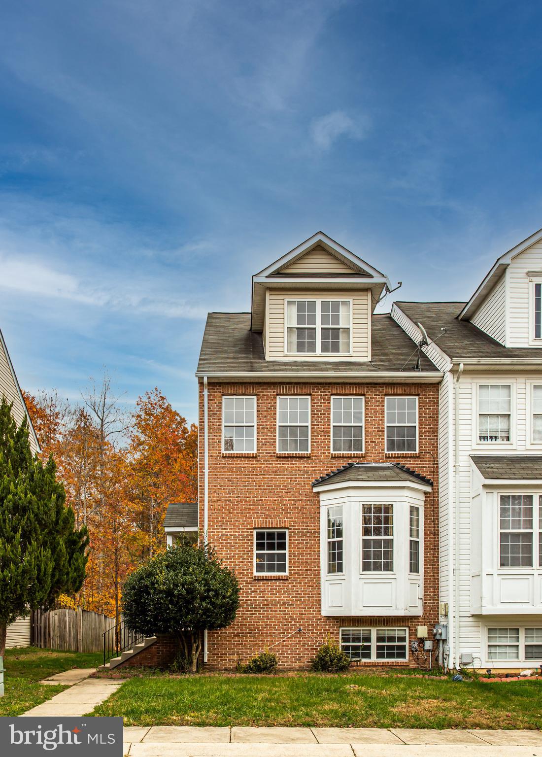WELCOME to this GORGEOUS UNIQUE 4 LEVEL end unit townhome nestled in a cul-de-sac waiting for YOU! This custom build offers 4 bedrooms, 3 full baths and 1 half bath. Upon entering, you are greeted with gleaming hardwood that flows into the open living spaces. Enjoy the HUGE Family/living room, paired with a beautiful bay window perfect for décor and/or relaxing. The kitchen offers stainless steel appliances, alongside a cozy fireplace to enjoy a good meal in the adjoining dining area.  On the 2nd floor, you will find 2 LARGE bedrooms with walk-in closets, full bath in the hallway, and a HUGE laundry room equipped with washer and dryer. This model then offers a UNIQUE 4th level Owner's Suite adorned with hardwood throughout, 2 walk-in closets, 1 storage closet, and an en suite bath outfitted with dual vanities, jetted soaking tub and separate shower. What's not to love? Let's stroll on down to the basement where you'll find another living space that can be used separate, or together with the rest of the home. You'll find a HUGE open rec area, closet, true bedroom, full bath, linen closet, and a large storage area. Walk up steps lead to the fully fenced backyard great for entertainment.  NEW CARPET throughout, and HOME WARRANTY until 2026 transfers to new owner! $1,000 seller CREDIT TO BUYER for any cosmetic upgrades you may desire! Take you tour today and see ALL there is to love about 10750 Jacksonhole PL!