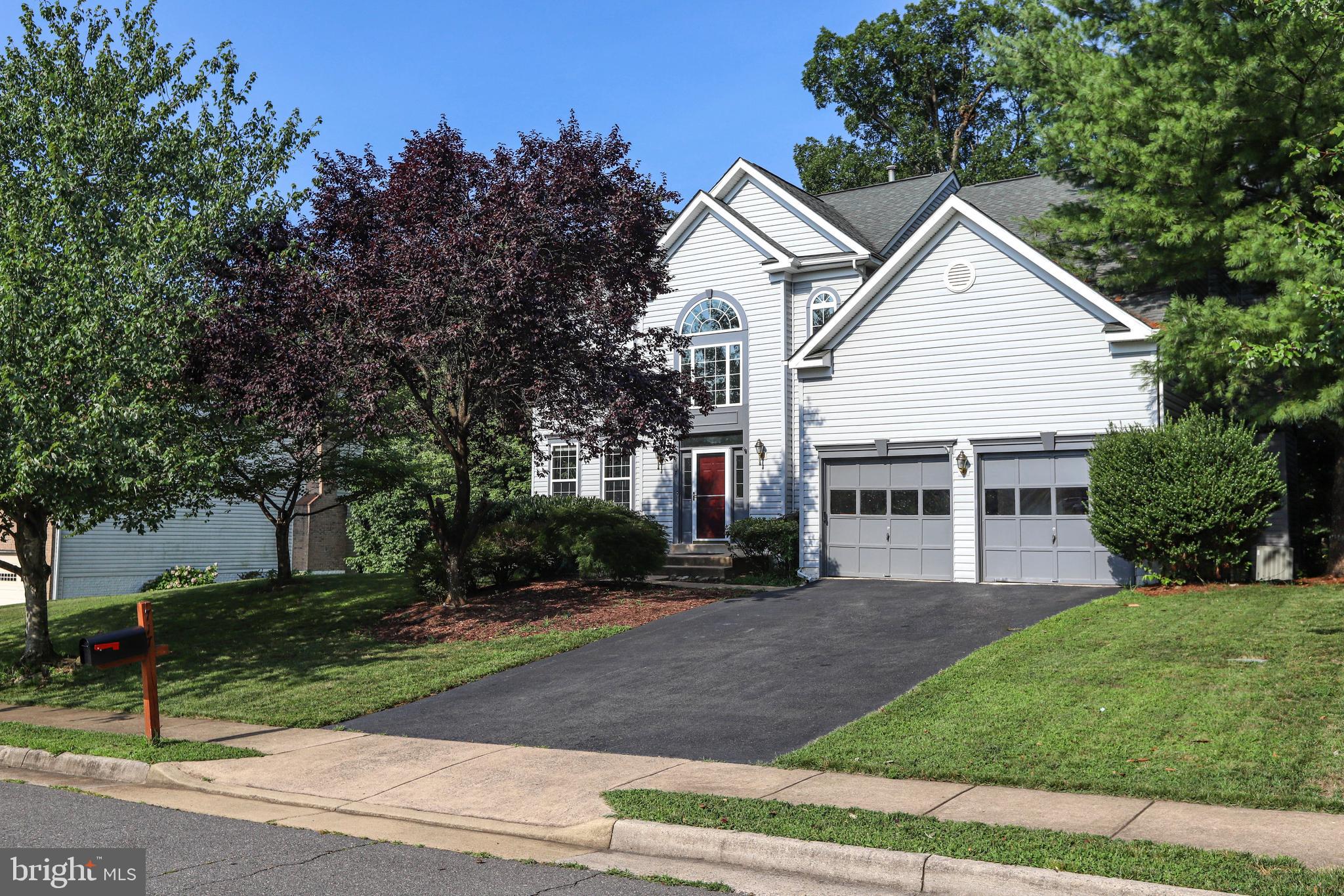 Grand 2 story foyer; hardwood floors in entire house; Granite counters & upgraded appliances; Beautiful owners suite with luxury, renovated bath and huge walk in closet; great deck and fenced yard backing to lush trees; Lower level completely finished with 5th bedroom and full bathroom.