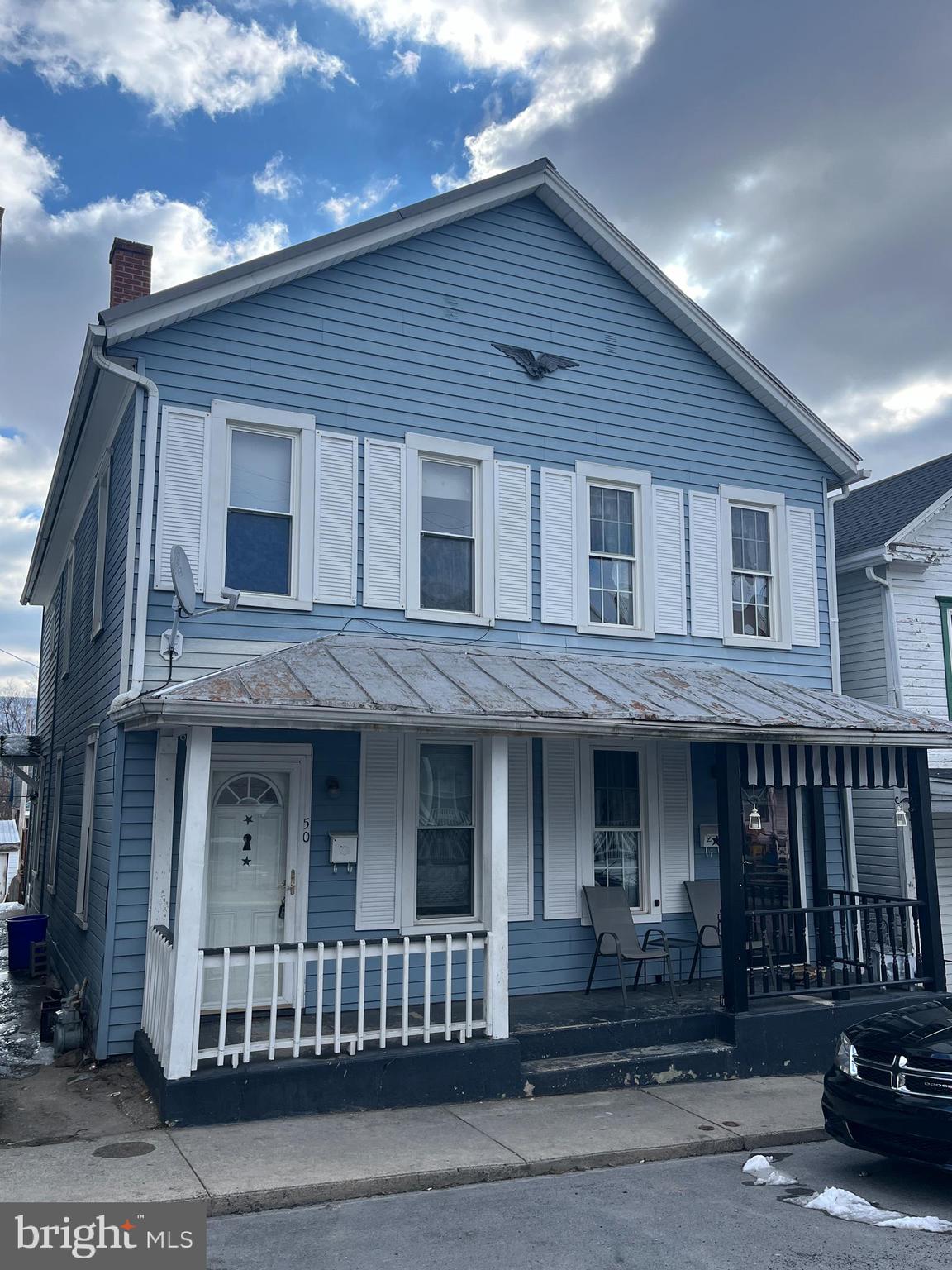Well-maintained half-double with 3 bedrooms, natural gas heat, fenced in back yard, off-street parking, updated windows, front porch & rear deck. Listing agent is co-owner of property.