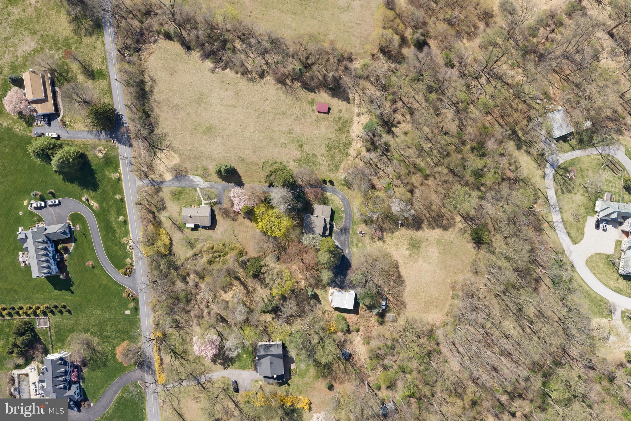 This tranquil Country Estate has"LOTS" of POSSIBILITIES- peaceful privacy w/ 3 dwellings on 7.2 acres.  It's Very RARE to find a property like this - look 360 degrees & only see your property, yet just mins. to the Main Line- Must see to appreciate the panoramic views! Subdivision started - may be able to have 3 existing dwellings on 1 LOT, & potentially 2 building LOTS that can fit larger homes, pools, barns- like across Diamond Rock!  You can finally get what you've been looking for- whether it's  a family compound, organic gardens, room to run, play sports, build the dream house you have plans for, or just relax & watch the sunset in peaceful harmony with the beautiful world around you!  Main House has 4 BRs, 2 Bths, Caretaker's Cottage has 2 BRs, 1 Bth, & Studio/Apartment above oversized Garage has 1 BR & 1 Bath.  If you want to bring horses - there's  2 nice flat Meadows, one w/ stone run in shed w/ feed bin, & one w/newer storage shed, all bordered by mature trees..  "Diamond Meadows"  has a stone wall fronting the quiet part of Diamond Rock - near Clothier Springs & Horshoetrail, w/ houses across the street backing to Valley Forge Woods & Phoenixville Country Club, mins. to trails of VF Park & Swim Club.  A charming Caretaker's Cottage has 1 floor living: Family Rm, 2 BRs, 1 full Bath w/ skylight, Laundry Room, Kitchen open to DR w/ picture window, & full bsmtt.  Next up the drive is Main House w/ a Great Rm that's width of building, & has superb light from 3 walls of windows, w/ 4th wall having a section of stone where there was a wood stove.   Spacious eat in Kitchen w/ Butler's Pantry & door to back yard.  Also on this floor is a sunny Dining Rm, Full Bath w/tub, & big Laundry/5th Bedroom.   Upstairs are  4 large Bedrooms & full Bath, all w/ good sized closets,   At the end of the driveway is an oversized detached Garage w/ big Laundry/ Storage Rm on main floor & upstairs is a charming Apartment that would be  perfect for an Artist's  Studio-  as there's lots of light from many windows & a big picture window in the Bedroom.  Floorplan has Kitchen open to Family Rm.  & Dining  completes this space.  This canvas is ready for your ideas - family compound,  farmette foranimlas, fields of flowers or holisitic/organic gardening to be self sustaining or start a farmstand! This desirable location lets you get everywhere quickly, & lets you live in harmony w/ nature & truly appreciate what a level 7.2 acres on VF MTN. provides. This homestead was started in 1920 by the Woodward family, who owned a Hat Shoppe in Phila.  Close to the Main Line, but calm in the country- mins. to the R5 train in Paoli!  Seller has started engineering work for potential subdivision, & LOT #1 may be available as the perfect family compound w/ 3 structuress, & then have 2 building LOTS !  See attached Plot Plans in documents or call Missy for updated info. Excellent location close to it all - the Main Line, Paoli Hospital & train,  Hip & Happening Phoenixville, Valley Forge Park, King of Prussia,  the turnpike, Rts. 202 & 422. Really does have so much to offer - are you ready to make your dreams come true? The main house homesite was probably chose in 1920 for its fabulous southern exposure, & has many possibilities - maybe add a MBR over the Great Room?  Improvements inc: new septic system for Main House & Garage Apartment, some new roofs, & new heater in Main House- so you could move right in or create the Home of your dreams!  COME feel the tranquility & see the panoramic views on SUN. 5/17  Open House 1 to 3 - LOTS  of Possibilities - what will it be for you?