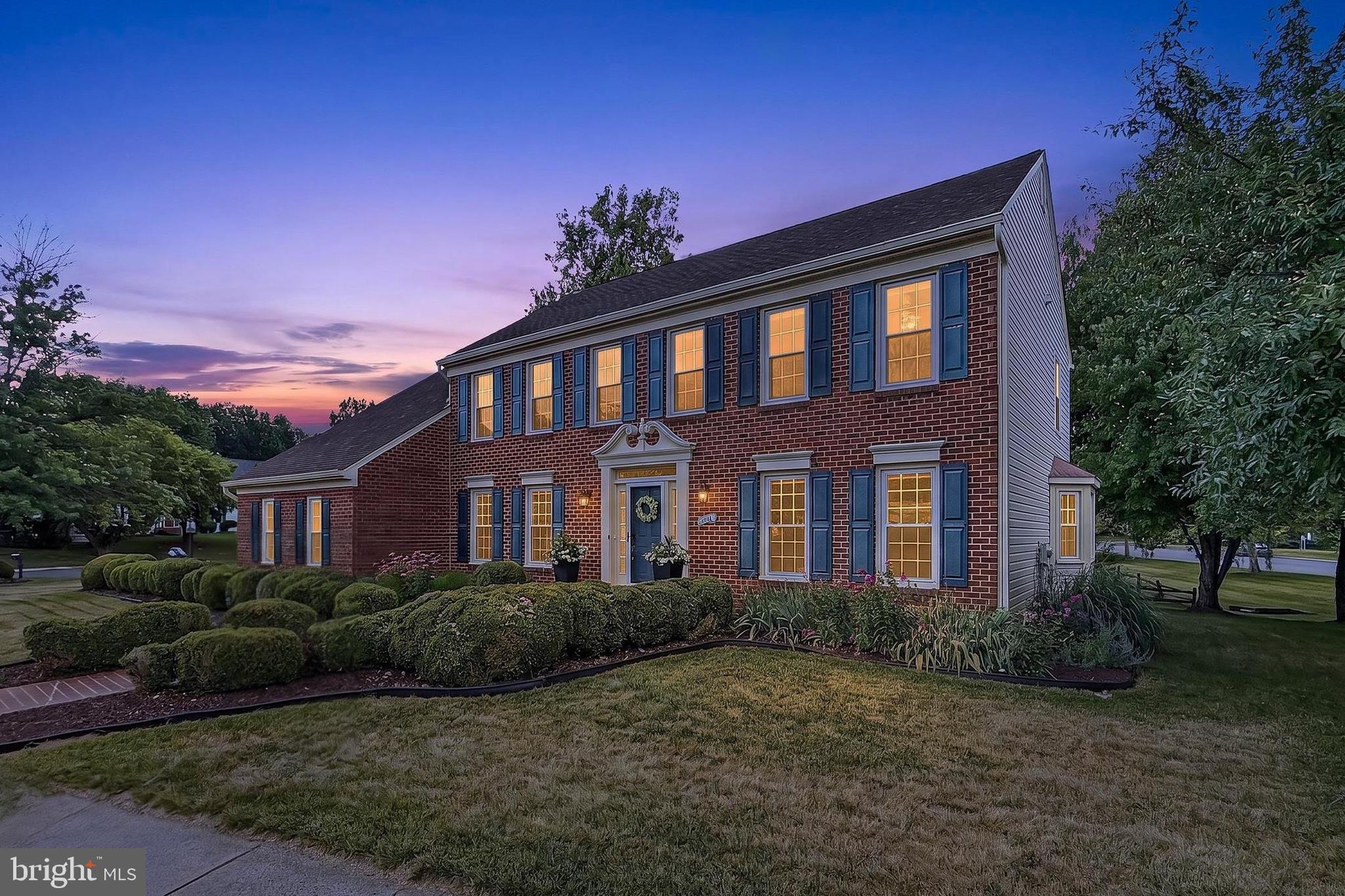 Welcome home to this stately brick-front colonial, beautifully sited on a premium corner lot in the heart of sought-after Sully Station! This spacious 5-bedroom, 4-full bath, 4,396 square foot home offers nearly 4,000 finished square feet of living space across three thoughtfully designed levels. The beauty begins outside with the stately brick facade with a two-car side-loading garage, brick walkway, expert landscaping, a 3-season sunroom, large deck, and a lush yard with playset dotted by majestic trees. Inside, a gracious hardwood entry sets the tone from the moment you arrive, while an open floor plan, decorative moldings, chic upgraded Alexa enabled smart lighting, and an abundance of windows with custom blinds throughout that create instant appeal. Major systems have been thoughtfully maintained, including a new roof (2025), a new HVAC system (2021), and a new 75-gallon water heater (2021), along with windows replaced throughout the entire home, new gutters and gutter guards, and updated house wrapping (2016) — giving buyers true peace of mind. A formal dining room and living room that flows into a warm spacious family room boasting a gas fireplace and sunny bay window, along with the impressive kitchen with a center island, sleek cooktop, double wall ovens and a breakfast room are perfect for entertaining and comfortable everyday living alike. A standout feature of the home is the main-level bedroom with full bath that offers flexible space for guests or a home office. Retreat upstairs to the primary suite, complete with a private sitting room, three walk-in closets, and a spa-like bath with a dual sink vanity, separate soaking tub and glass enclosed shower. Three generously sized secondary bedrooms share access to the hall bath, while a full-sized washer and dryer on this level add everyday convenience that's rare to find in this neighborhood. The fully finished lower level adds even more functional living space with a multi-area rec room, full bath, den, storage, and workshop. Enjoy seamless indoor-outdoor living through the three-season porch that leads to the private deck — all within a vibrant community offering pools, tennis courts, and tot lots. This is the one you've been waiting for!