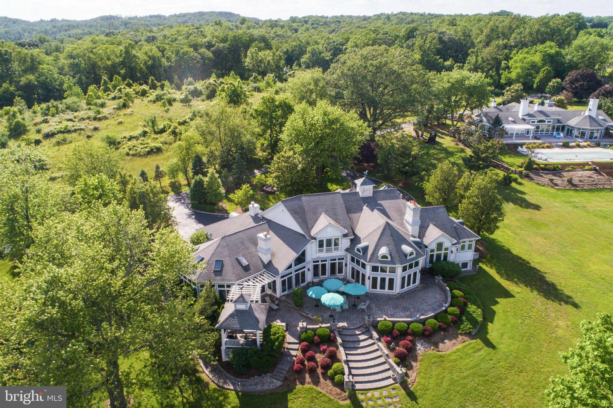 Welcome to Osprey Cove!  Panoramic views of the Elk and Bohemia Rivers are seen from this meticulously cared for waterfront home located among an enclave of 6 luxurious homes, nestled on 50+ acres. Well maintained by a full time caretaker.  Enjoy the privileges of a waterfront home. Whether hosting family and friends or enjoying a quiet moment on the spacious back patio, at the indoor pool or on your private pier, this home rises to every occasion.  Designed for entertaining on a grand scale.  This 7,000 + sq. ft. contemporary showcases fine living.  Appointed with 18' cathedral ceilings, floor to ceiling windows and an open floor plan that is streaming with natural light.  Gleaming hardwoods, stone fireplace, built-in bookcases, game room, heated master bath tile floor, formal terrace and professionally landscaped grounds.  3 car attached garage. Designed for low maintenance, energy-efficient living and offers luxury living year-round.  Welcome Home!