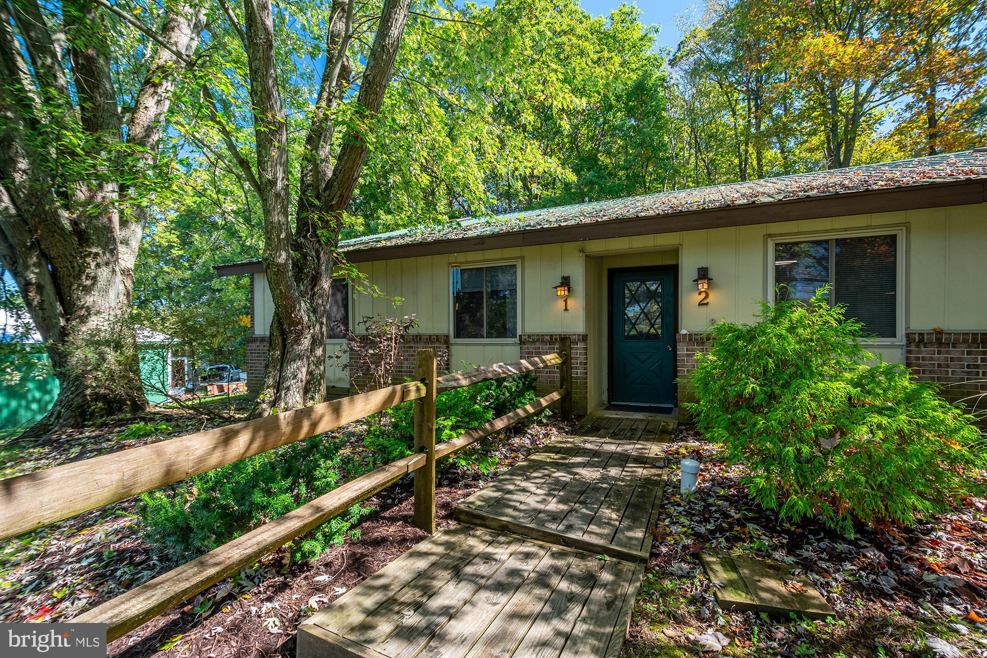 2BR+ office/den, 1BA / fully renovated (2024) condo in McHenry. End unit, ski slope & mountain views, peaceful community with mature trees, fire-pit and plenty of parking. Metal roof, one level living,  1.5 miles to lake & ski slopes. Brand new metal batten siding  in process of installation. Owner financing for qualified buyers, >20% down. Owner is a licensed real estate agent in MD.