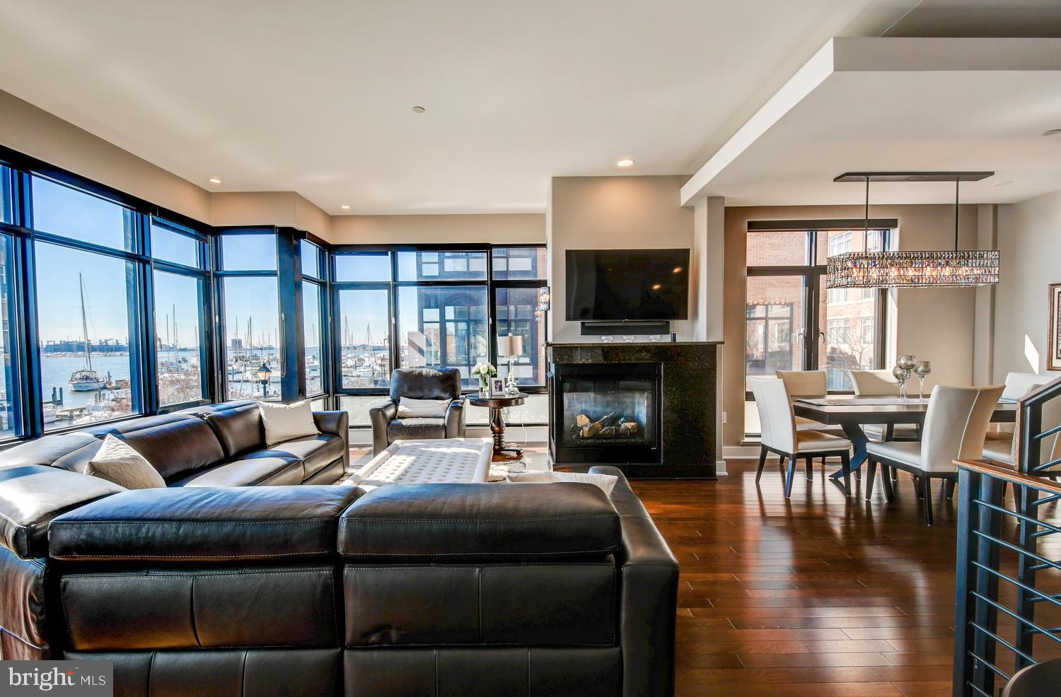 Rarely available and absolutely stunning Crescent Townhome in Fells Point. 3 Bedrooms / 3  Full and 2 Half Baths plus a large Family Room. This is the one of the most exquisite waterfront homes in Baltimore. Over 4000 sq ft of ultra luxury living space with wide-open, panoramic views of the Crescent Marina, Canton waterfront, open harbor all the way to the Key Bridge.  Light filled rooms on each and every level. Recently remodeled - pristine condition. High ceilings, superb layout for entertaining. Floor to ceiling windows, large rooftop terrace, fantastic location.  If you are looking for the cream of the crop in Baltimore - you just found it.