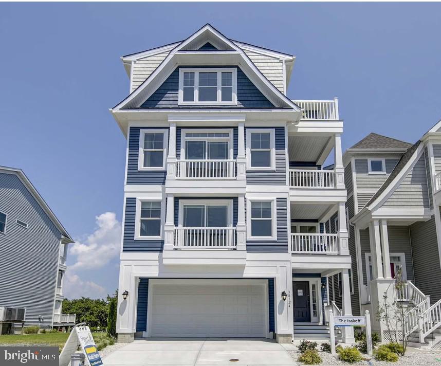 Insight Homes is taking the guess work out of developing this stunning bayfront property located just blocks from the beach!  They have a 4-story home design that will fit on this rare bayfront building lot and have already selected the structural options that they think would enhance this home.  After purchasing and settling on the building lot from the current owners for $2,700,000 the option to proceed with Insight Homes to build their Isakoff home becomes a smooth and easy process.  Insight Homes has carefully chosen all of the structural options they think you would love and the price of the home itself ($1,534,068) includes a $175,000 designer allowance to give the buyer the freedom to choose their own finish selections at Insight Home's design studio.  Structural options already made by the builder can still be modified which could increase or decrease the price of the home.   The only structural option that must be made is a side-entry garage and the builder has included an estimated contingency amount in the quoted price for this structural change.  An estimated site cost allowance is also included in the price of the home.  Pictures provided in listing are of Isakoff model home and do not reflect specific options that were selected for this potential build but provide an example for potential buyers to get a real feel for all that this 4-story home and all that it has to offer.  Imagine the water and city views from 10 different outdoor spaces, including porches, decks, and balconies.  The Isakoff will feature an elevator and owned solar panels to add to this already energy efficient home.  This is a once in a lifetime opportunity to own an undeveloped southern exposure bayfront parcel of land in Ocean City, MD.  Enjoy incredible sunsets from your home once this property is developed and live a convenient relaxing lifestyle with a short walk or bike ride to the beach.  Lot lines on pictures were completed by the photographer and are for demonstration only.  Buyers should rely on the recorded subdivision plat attached to the listing for lot line placement.  No builder tie-in. Option to build with Insight Homes is just that, an option.
