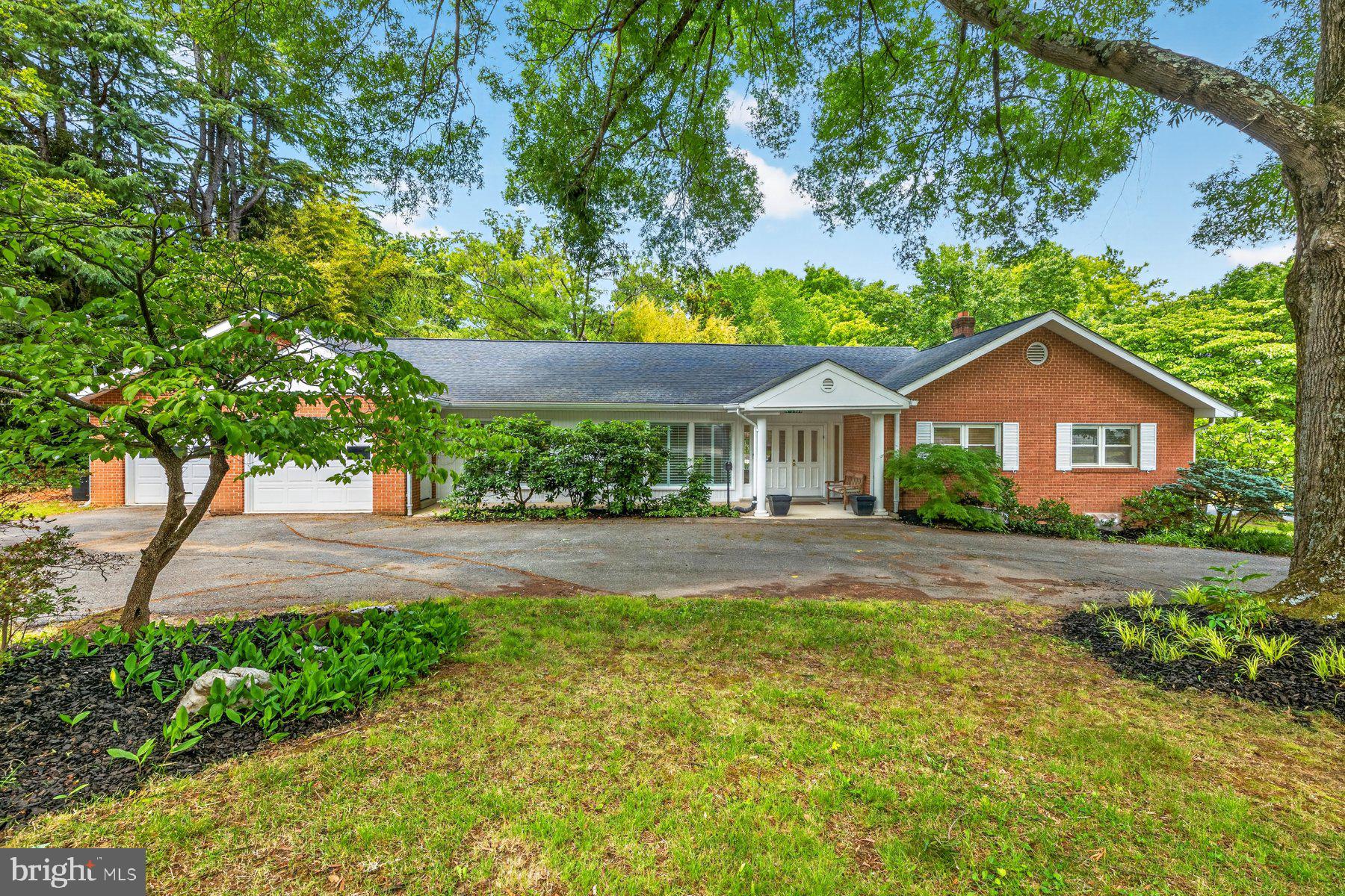 Some addresses speak for themselves. 3101 Brooklawn Terrace is one of them.
With Rock Creek Park and Beach Drive right outside your door. You've got easy access to nature, the Meadowbrook stables, walking paths, and so much more right there. On weekends, the section of Beach Drive that's closed to cars is just down the road. Meadowbrook Stables is nearby, and the Candy Cane City playground is steps away. This is the kind of address that people describe to their friends years after they've moved, because there is nowhere else quite like it.
After 30+ years with the same owners, this classic brick rambler is ready for new memories. Situated on a generous corner lot with a circular driveway, two-car attached garage, and the kind of mature canopy that takes decades to grow, it’s a special situation. At 3,431 finished square feet across two levels, it is larger than it looks from the street. 
Step inside through the double front doors and feel the space. The main level flows through a formal living and dining area — hardwood floors, plantation shutters, recessed lighting, and a built-in buffet that anchors the dining room — and then transitions into the heart of the house: a vaulted family room with skylights, large-format stone floors, a stacked stone fireplace with electric insert and a wall of windows and sliding doors that frame the pool and backyard beyond. The kitchen sits open to this space, generous and practical, with white cabinetry, two pantries, enough space for a real kitchen table, and a window over the sink looking out to the yard. The rooms feel connected to each other and to the outside in a way that is unique.
The primary bedroom is quietly impressive: hardwood floors, a wall of shoji-style sliding screens, a ceiling fan, and an en-suite bath. Two additional bedrooms share the main level, each with built-in storage that the sellers say they will genuinely miss. A flexible sitting room — previously configured as a fourth bedroom— works as a home office, reading room, or whatever the next owner wants it to be.
Downstairs, the finished basement adds 877 square feet of flexible finished space — a large rec room with recessed lighting, a walk-out door to the backyard, and a separate bonus room that has served as a home gym and can serve as an office, studio, or whatever else you’d like. 
Back to the family room and the screened porch. The porch is a wonderful space for outdoor living, complete with a built-in outdoor grill with a separate flue. It’s the entryway to all that the back yard has to offer. The backyard is private, fenced, and deep. The pool is there. So is a lovely patio, established gardens, and the kind of wooded backdrop — including a stand of bamboo along the rear fence line — that makes the yard feel like more than a yard. 
This is a house for people who want space, nature, and a real neighborhood — and who know that those three things rarely come together at one address.
SOME PHOTOS HAVE BEEN VIRTUALLY STAGED.