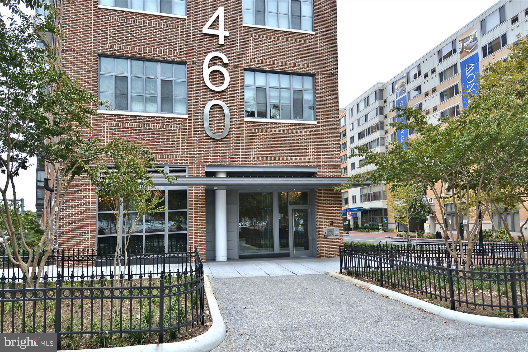 Location, location, location...and an amazing, elegant, open and spacious 2 bedroom, 2 full bath condominium with garage parking (Space #4A) and extra storage unit (#15) make this the ideal home to enjoy city living at its best.  Freshly painted throughout, the unit features a wall of windows with custom remote controlled blinds, a gourmet kitchen with quartz countertops and stainless steel appliances, a Juliet balcony, a newer outside AC unit, new bathroom and kitchen faucets, high ceilings, wide plank floors, and even a home warranty.  It is close to grocery, restaurants, metros (yellow, green, and red lines), and a dog park -- it has earned its 97 walkability score.  This PET FRIENDLY building (Cats & Dogs allowed with NO WEIGHT RESTRICTION FOR DOGS) has a secure entrance with a concierge desk and great community space with a rooftop lounge and terrace where you can enjoy amazing views of the city and host private events.