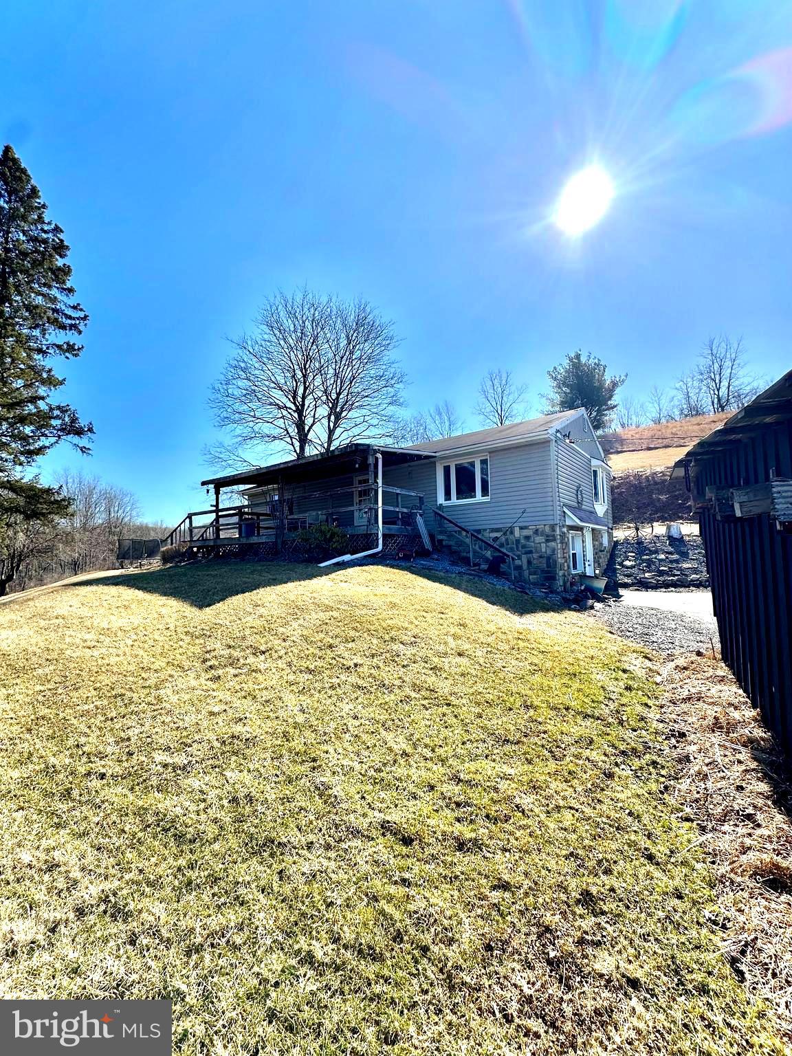 Check out this 4-bedroom 1-bathroom home with elegant views and lots of opportunity. Approximately 20 minutes from downtown State College and on the hill side of Colyer Lake. Charming beauty awaits with 3.73 acres of land. Newer hardwood floors throughout the kitchen and living room area with a walk out porch to enjoy family gatherings. Enjoy the downstairs with a family room and unfinished space to make your dream home.