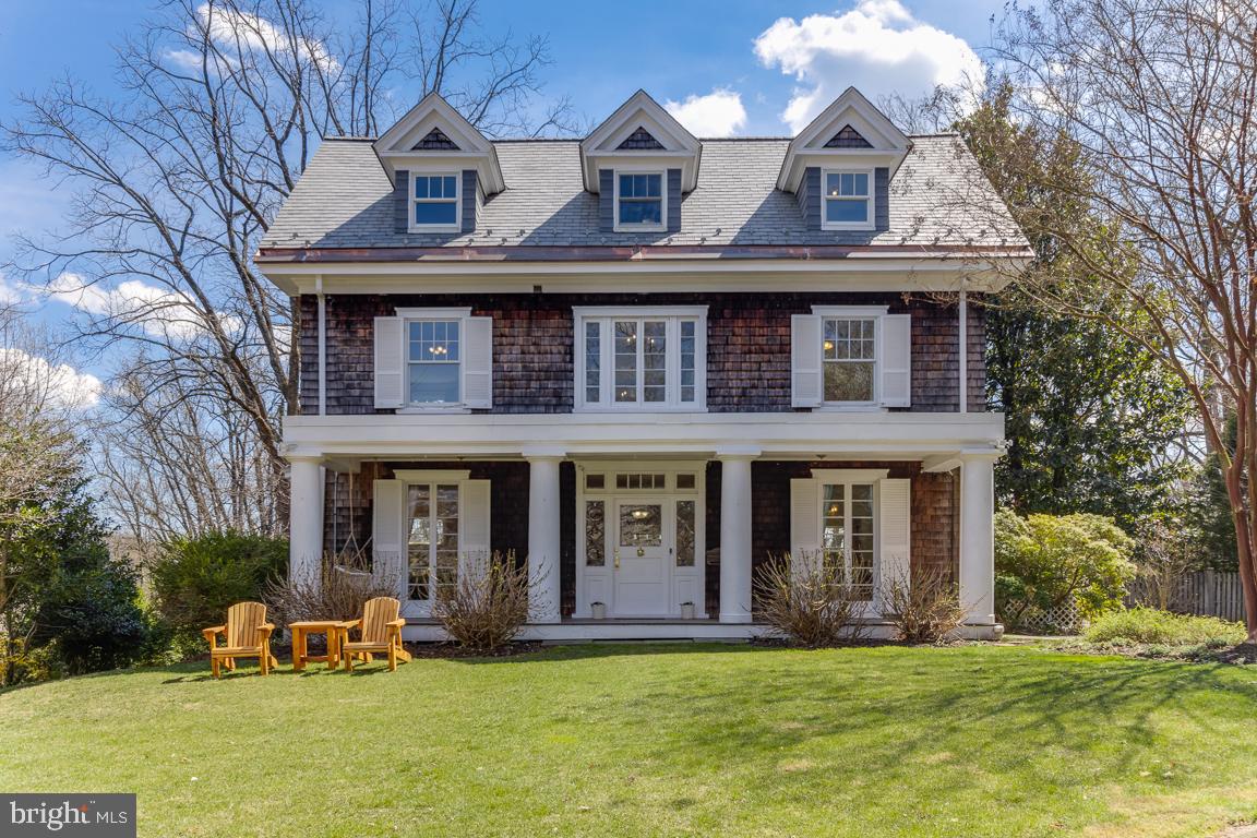 This stunning 5-bedrooms, 3-full baths, and a half-bath colonial home is located in the desirable Mount Washington neighborhood of Baltimore, and is set on a beautiful, private, half-acre landscaped lot. The elegant veranda with stunning stately pillars and new composite deck opens to a welcoming foyer revealing a spacious open floor plan that is perfect for entertaining guests. The foyer opens to a cozy living room complete with a wood-burning fireplace with built-in bookshelves and a wonderful bay window seat for reading, with gorgeous views of the trees and a private lot. The main level also includes a formal dining room full of light that opens onto an open luxury kitchen and a new half-bath. The large kitchen features an integrated speaker sound system, with updated double-glazed windows that match the original style of the house, luxury stainless appliances, new oven (2022) and dishwasher (2023), granite countertops, and an island for your family dinner and entertainment, with lots of luxury hardwood cabinetry. Walking out of the kitchen you enter a cozy sunroom for your morning breakfast, opening onto a large, renovated deck with new low-maintenance composite luxury deck flooring, leading into your private backyard for your family and friends' reunions and barbecues.
The grand staircase leads to the second level where you will find three generously sized bedrooms, each offering ample closet storage. The owner's suite includes a fireplace and sitting area for your morning meditation, a walk-in closet, and a luxury en suite bathroom with heated floors and marble tiles, a shower with luxury fixtures, double marble vanity. The two other bedrooms share a renovated bathroom with marble tiles and a bathtub with a hand-held shower. Walking out from the bedrooms, you enter an open space perfect for an office or sitting area. You are sure to appreciate the beautiful new hardwood oak floors throughout the home. Two additional large bedrooms are located on the renovated third floor, opening into your second office space and sharing a newly renovated large bathroom with heated floors, a classic clawfoot bathtub, and a shower. The house boasts many original features, with brass hardware and light fixtures from the 1900s.The current owner has made investments in replacing the original slate roof with new synthetic slate in 2018, repointed the chimney (2018), installed a new hot water heater (2016), a new boiler (2021), replaced the original built-in gutters at the front of the house with a new copper lining (2022), installed a secondary gutter system at the back of the house (2021), two-zone AC, the one located on the 3rd floor has been replaced (2016), installed new cedar shingles on the back south facing side of the house, and the home interior has been freshly painted! The basement offers an ample handyman workroom and space for rooms or a workout gym. This home boasts an excellent location near the many schools in the area including private schools Gilman, Boys Latin, Bryn Mawr, Roland Park Country Day, and Park, St Paul's and  Friends School in addition to the Roland Park and Mount Washington public schools. This unique and impeccably maintained property is the best of both worlds, situated on a private, quiet wooded lot but just minutes from local amenities and the entry to the I-695 and I-83 corridor, community pools, and walking distance to the authentic historic Mount Washington Village's shops and restaurants, Sinai Hospital, and Mount Washington Pediatric Hospital.  Prime location, also within walking distance to the light rail, Whole Foods, and the newly completed nature and bike trails, offering scenic exercise opportunities for the whole family. You won't want to miss this one-of-a-kind opportunity to own a truly unique, exquisite, and impeccably maintained home in Baltimore! By appointment only with a listing agent.