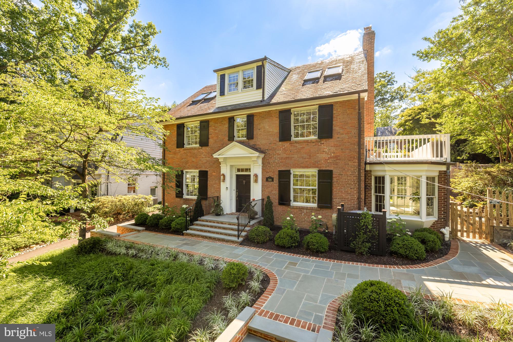 Nestled on a picturesque street in the heart of the Town of Chevy Chase, 7104 Beechwood Drive is a beautifully updated residence that seamlessly blends timeless character with modern comfort. Bathed in natural sunlight throughout the day, the home offers bright, inviting living spaces and a warm, welcoming atmosphere from the moment you step inside.

Thoughtful improvements can be found throughout the property, including a renovated kitchen, extensive landscaping enhancements, and numerous updates that elevate both form and function. The beautifully landscaped grounds create exceptional curb appeal, while the private backyard serves as a tranquil retreat surrounded by mature trees and lush greenery, an ideal setting for outdoor dining, entertaining, gardening, or simply unwinding.

Inside, the home offers six spacious bedrooms and a highly functional floor plan designed for today's lifestyle. Multiple bedrooms are thoughtfully situated together, creating a convenient and connected layout, while the finished attic spaces provide remarkable flexibility for guest accommodations, home offices, creative studios, fitness rooms, or additional living space.

One of the home's standout features is the beautifully designed mudroom, offering exceptional organization and everyday convenience. The inviting patio is another favorite gathering place, perfect for enjoying a morning coffee, or simply taking in the charm of the neighborhood and beautiful trees.

Life in the Town of Chevy Chase is truly special. Known for its tree-lined streets, distinctive architecture, and strong sense of community, the neighborhood offers a setting that feels both peaceful and connected. Residents enjoy walking among the mature canopy of trees, admiring the unique homes that define the area, and experiencing the timeless character that has made the Town of Chevy Chase one of the region's most beloved communities.

7104 Beechwood Drive presents a rare opportunity to own a thoughtfully updated home with exceptional indoor and outdoor living spaces in one of the area's most cherished neighborhoods.