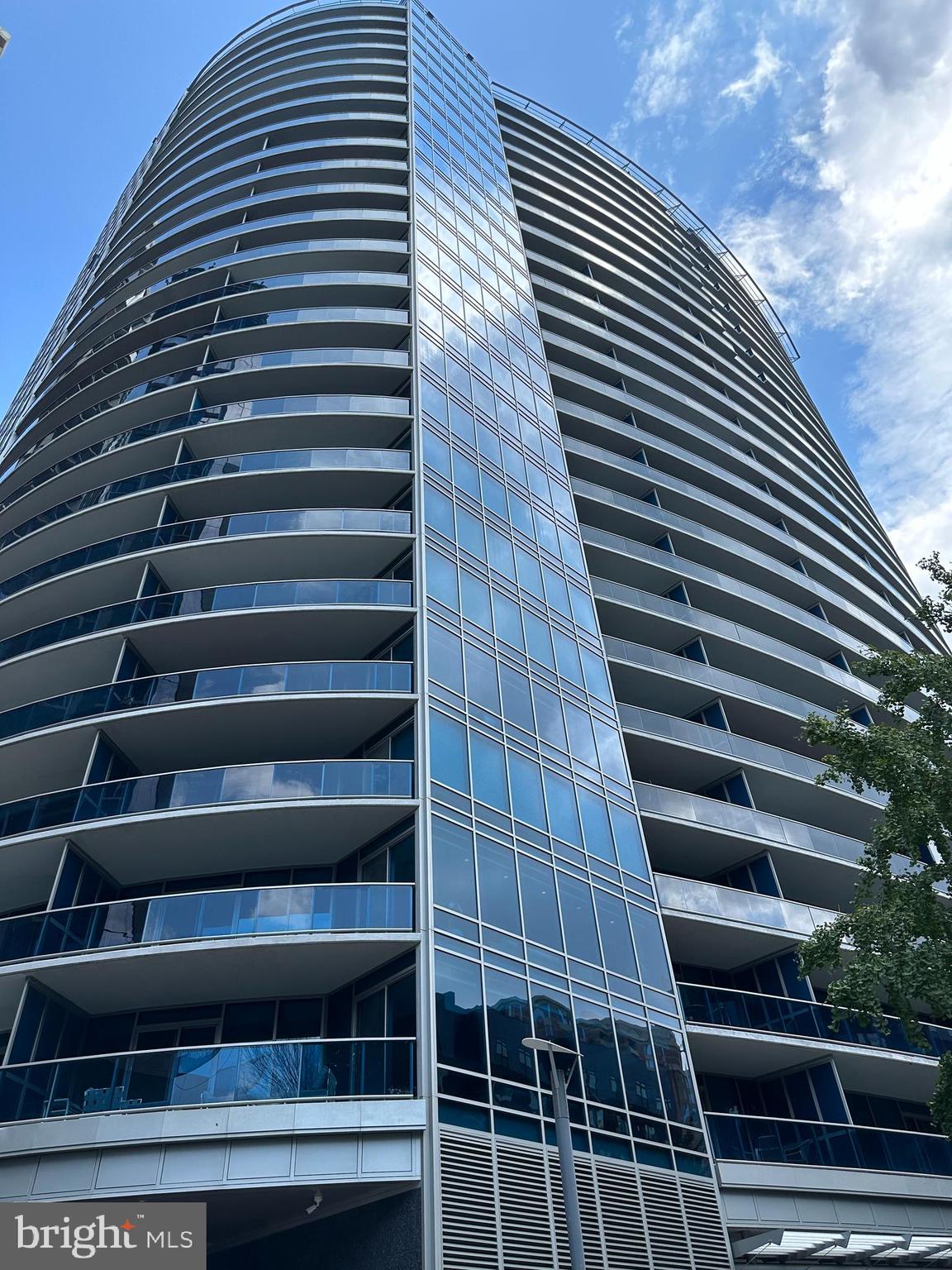 Spectacular 2 bedroom 2.5 bath penthouse-level luxury condominium in acclaimed Turnberry Tower now available! A private elevator whisks you to the 19th floor where the doors open to a private foyer leading to a 2,039 square foot, 11 foot ceiling dream home. A 400 square foot balcony spanning the width of this unit enables you to enjoy unobstructed views of Rosslyn below and Georgetown and the Potomac River to the right.  Both bedrooms and the main living area have sliding glass doors leading to this fabulous outdoor space which is far away from the current construction projects in Rosslyn. The gourmet kitchen is every chef’s dream  with Snaidero Cabinetry, granite countertops, subzero refrigerator and Miele appliances which include a five burner gas stove, built in microwave, wall oven, warming drawer, espresso/cappuccino machine and wine cooler. The powder room is conveniently located by the foyer, and the laundry room has a stacked Miele front load washer and dryer. The luxurious main living area has an open floorplan.  One side has a built-in wall unit with plenty of shelf space and room for a flat screen TV.  There is also an area which can be used as a dining room or an office/den. On either side of this great space are two en-suite bedrooms. The primary bathroom has marble floors and marble countertops, a soaking jacuzzi tub and ample shower area. The primary bedroom has two walk-in closets with Contemporaria-designed custom built shelving and drawers. The second bedroom also has a walk-in closet with Contemporaria-designed custom built shelving along with a full bath with a jacuzzi tub/shower.  Large plank Brazilian cherry wood floors grace the main living area and bedrooms. What sets this desirable floorplan apart from many at Turnberry Tower is that all rooms are spacious and have endless options since they are rectangular in shape. The unit comes with two garage spaces.  The assigned one is an extra-long one with room to store bikes, etc. and is located on parking level 4 (P4-29).  The other space is valet parked, and guests visiting you can also enjoy the valet parking amenity.  This unit comes with an oversized (14’ by 7.5’) private storage room conveniently located next to the elevator bank on the G6 level (room #BG 6-03). Turnberry Tower amenities are unmatched with white glove valet service, a 24-hour concierge, fitness center, indoor pool, theater, business center, community room, community deck and so much more. The location cannot be beat in the heart of Rosslyn close to shopping and dining and a quick walk to the Rosslyn Metro Station and Georgetown.  Come see this gorgeous home today!