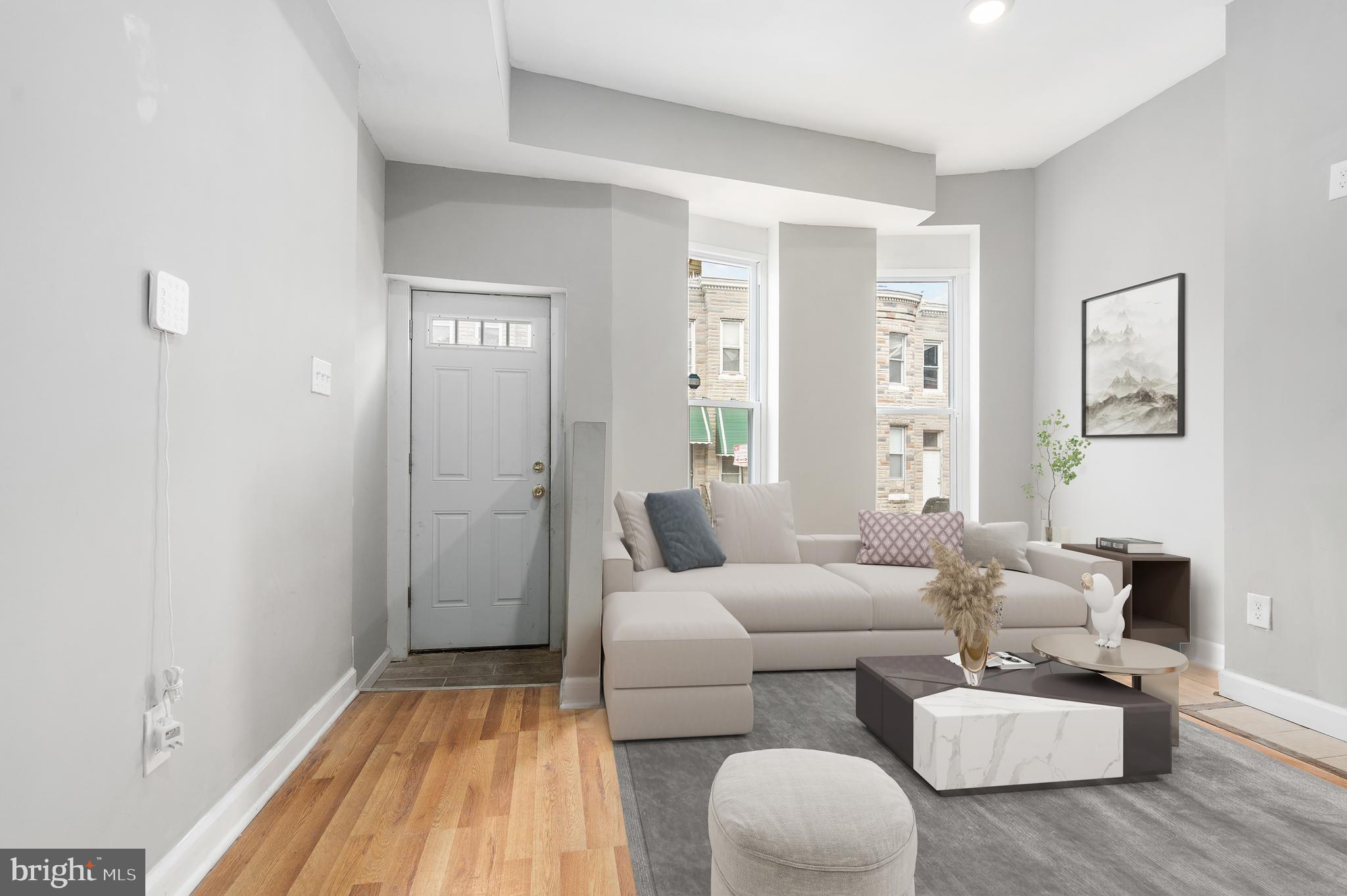 Welcome to this charming row home in Baltimore City! As you step inside, you'll be greeted by an inviting living room adorned with beautiful hardwood floors and bathed in natural light, creating a warm and welcoming atmosphere. The open concept design seamlessly connects the living room to the dining area and kitchen, making it ideal for both everyday living and entertaining. The kitchen features white cabinets, granite countertops, and a custom tile backsplash, providing a perfect blend of style and functionality. A convenient half bath on the main level adds to the ease of living. Upstairs, you'll discover the primary bedroom with an ensuite bathroom and two additional spacious bedrooms, each offering ample closet space to accommodate your storage needs. Another full bathroom ensure convenience and comfort for all occupants. The basement offers additional storage space and presents an opportunity to customize according to your preferences, whether it be a home office, gym, or recreation area. Outside, the quaint backyard and patio space beckon you to enjoy the outdoors, offering a perfect setting for gardening, relaxation, and entertaining during the upcoming summer months. With its desirable features, convenient layout, and prime location, this row home presents an excellent opportunity to embrace city living at its best. Don't miss out—schedule your showing today!
