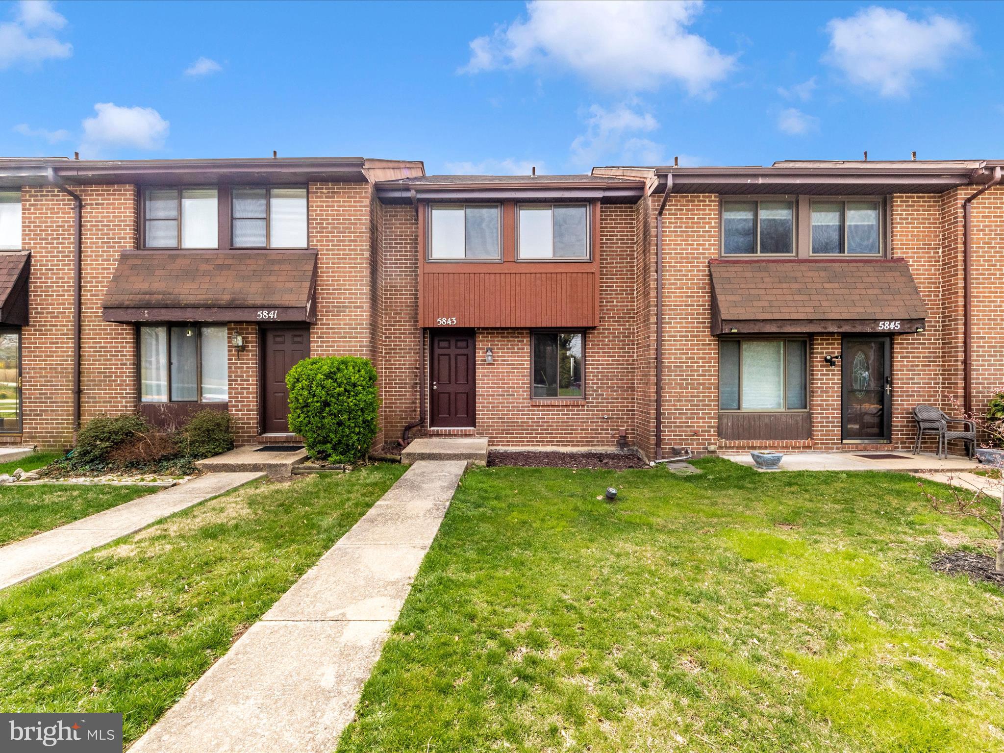 Welcome to this beautiful brick townhome in the Montgomery Woods community! This charming home offers 3 levels of spacious living, including a fully finished walk-out lower level. The main level features an open-concept living and dining area, a convenient half bath, and a kitchen with a picture window and space for a small table. Upstairs, you'll find two generously sized bedrooms and a spacious full bathroom. The fully finished basement adds even more living space with a cozy fireplace, half bath, and laundry/storage area. Step outside to enjoy your private fenced backyard and a cozy patio—perfect for relaxing or entertaining. Located just minutes from shopping, dining, BWI Airport, and major commuter routes, this home truly has it all. Don’t miss your chance to make it yours! 

Updates: 
New windows / Universal Builders (2022)
New Carpet (2022)
New Dishwasher (2023)
New Refrigerator (2023)
New roof (2024)