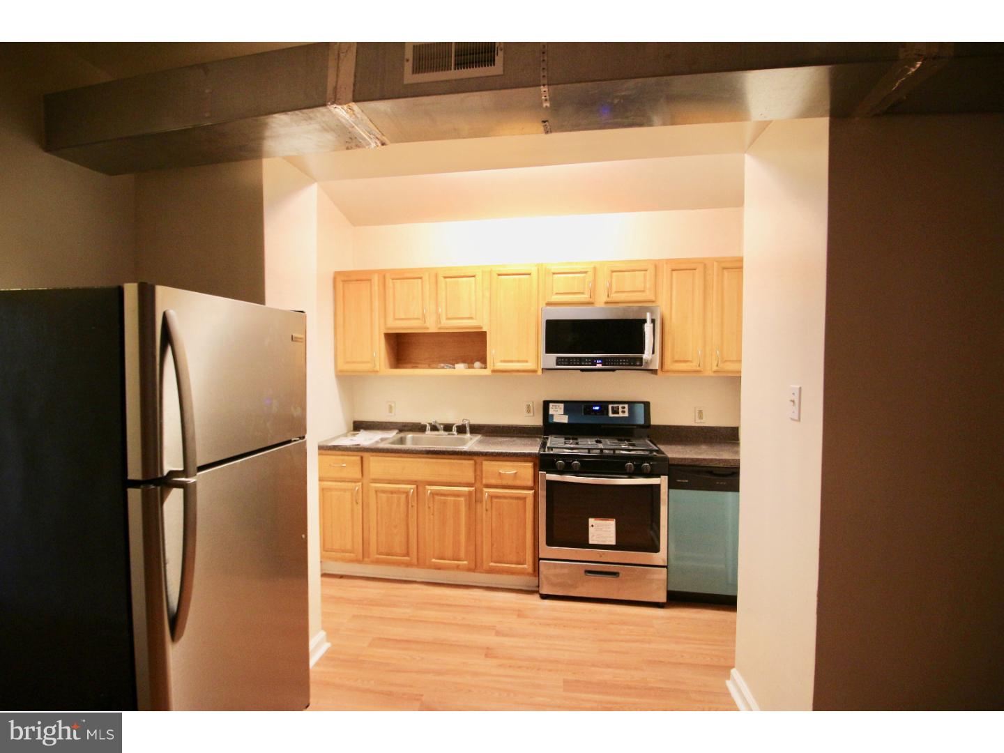 This apt was just renovated to add Stainless Steel appliances in the kitchen, including a dishwasher, and a Washer/Dryer in the unit.  This first floor unit is spacious and recently renovated unit with an awesome layout. Enter the unit, and the living room is to your left. It is elevated and has nice separation making this unit unique. There are two spacious bedrooms just off of the living room. The entire unit has Laminate Hardwoods throughout. Going back to the front of the unit you will pass the bathroom which has been updated with modern fixtures. The Kitchen has gas cooking and has enough space for a Dining table. The 3rd bedroom is in the back of the apartment and is nicely sized. You can fit a large bed, study area, TV stand etc.  Central Air throughout the unit. New stainless steel appliances installed in kitchen, as well as dishwasher. Washer and dryer in unit as well.  Tenants pay gas and electric.  This is considered the south side of Temple's Campus, and is close to the Edge, Fresh Grocers, the AMC Broadstreet 7 movie theater, pharmacies, and the Broad St subway. movie theater, pharmacies, and the Broad St subway.