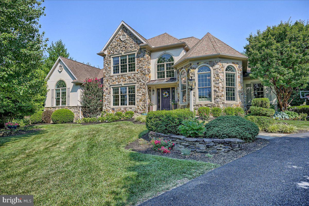 This is your opportunity to live in luxury in this beautiful 5 bedroom home in Bent Creek Country Club!   Situated on a quiet Cul-de-sac with a private fenced-in backyard, this home will immediately impress with striking curb appeal and landscaping.  The main level layout highlights a fully upgraded gourmet kitchen perfect for entertaining, and will exceed the needs of the most discerning home cooks.  The ample kitchen space is optimized with a large granite island, and an excess of lighted cabinets with smart storage solutions to keep everything well organized.  An unobstructed transition into the vaulted living room provides an open and airy feel that is punctuated by the natural light from the abundance of windows looking out over the back yard.  Or instead, go through the butler's pantry into the beautifully trimmed formal dining room that is sure to impress your many guests when hosting parties.  Productivity and functionality are effortless with a large well-lit office, a laundry room with ample storage, and a roomy three car garage.  A spacious primary bedroom and a second bedroom, each with their own full bathroom and roomy walk-in closet complete the main level and provide everything necessary for 1-floor living.  For those looking to take advantage of even more space, there is a 2nd floor with three more bedrooms and two full bathrooms, featuring a catwalk overlooking the vaulted living area that separates the guest suite for additional privacy.  When you're ready for some rest and relaxation, head downstairs into the large finished basement perfect for family recreation.  Located in one of the most desirable communities in Lancaster county, come take advantage of all of the amenities that Bent Creek has to offer, while also being a short drive from both Lititz and Lancaster city when you feel like a night on the town.  Schedule your showing now to see this stunner in person, as this home won't last long!
