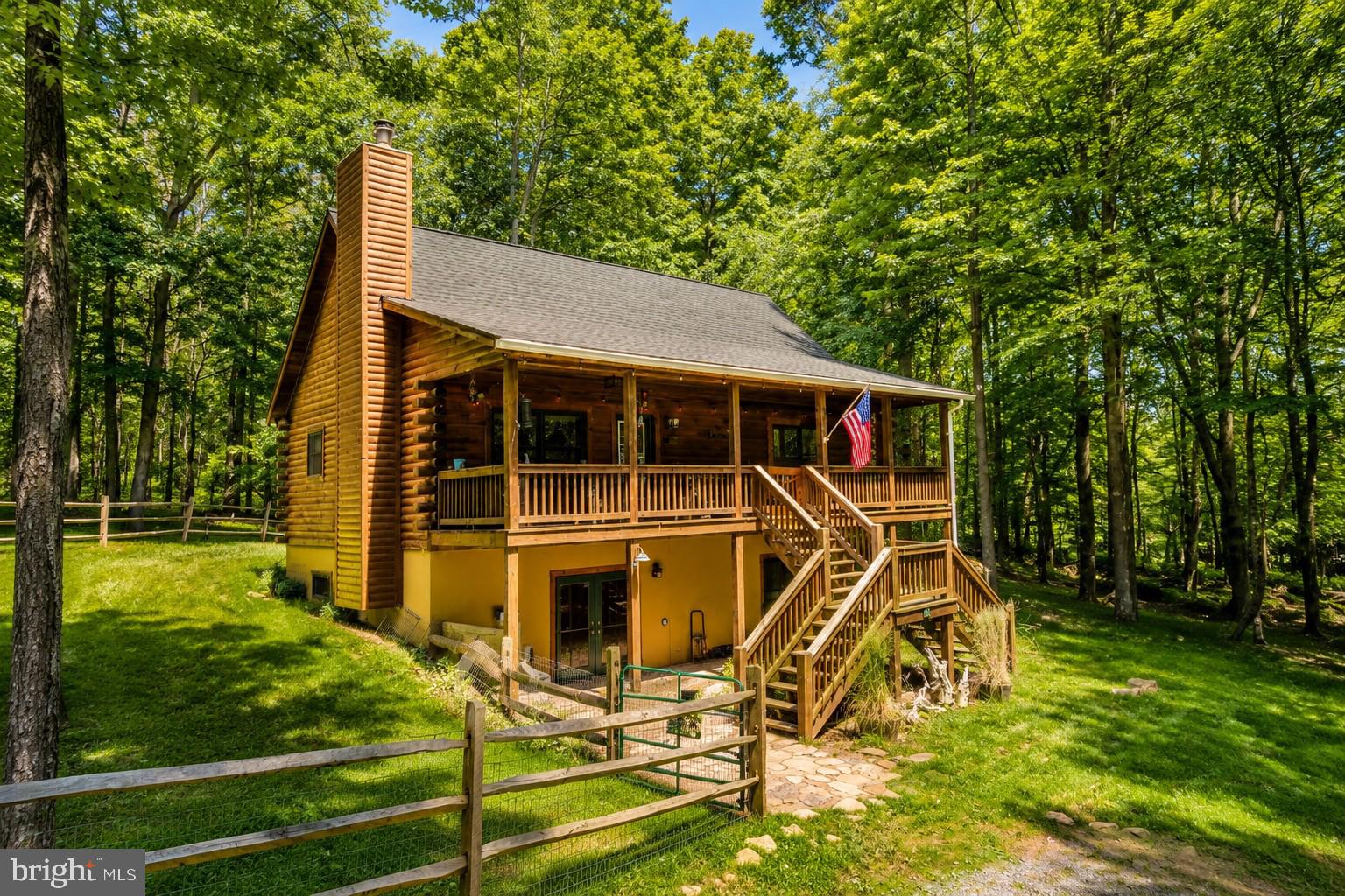 Escape to this comfortable 4 bedroom, 3-bath log home nestled in a private, wooded setting just minutes from Deep Creek Lake and Deep Creek Lake State Park.  Offering the perfect blend of rustic charm and modern comfort, this inviting mountain retreat features two cozy wood-burning stoves, a game/entertainment room on the lower level, a spacious covered porch, and an outdoor fire-pit-ideal for relaxing after a day of adventure.  Surrounded by nature and located near hiking & biking trails, this property is perfect as a year-round residence, weekend getaway, or vacation retreat.  Guests and owners alike will appreciate the peaceful setting while remaining close to all the area's recreational attractions.  Whether you're looking for a personal escape or an established Airbnb vacation rental, this cozy log home offers the best of Deep Creek Lake living.