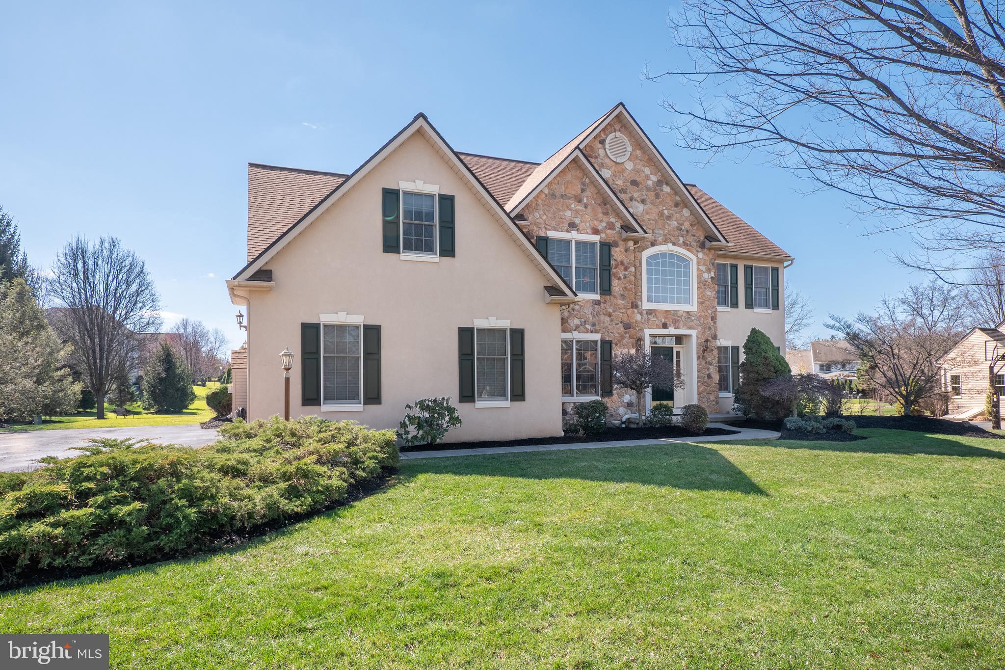 A rare offering of REFINED ELEGANCE and MODERN VERSATILITY, this exceptional 5-BEDROOM, 4 FULL + 2 HALF BATH residence is set within the PRESTIGIOUS SOUTHERN LEHIGH SCHOOL DISTRICT. Showcasing THOUGHTFUL DESIGN, this home delivers an elevated living experience tailored for today’s discerning buyer. From the moment you enter, SOARING CEILINGS and AN ABUNDANCE OF NATURAL LIGHT create a striking first impression, enhancing the home’s expansive and open feel. FRESHLY PAINTED THROUGHOUT, the interior reflects a crisp, modern aesthetic ready for immediate enjoyment. The GOURMET KITCHEN WITH GRANITE COUNTERTOPS AND CENTER ISLAND, coupled with the TWO-STORY GREAT ROOM, is ideal for everyday living. The main-level ADA-COMPLIANT, PRIVATE BEDROOM SUITE with SEPARATE INTERIOR and EXTERIOR ENTRANCES is ideal for guests or extended family. This private retreat includes its own living area, spacious bedroom, and a full bath with a WALK-IN SHOWER, along with direct access to the backyard TREX DECK. Upstairs, the PRIMARY SUITE offers privacy and a place to unwind, and 3 ADDITIONAL GENEROUSLY-SIZED BEDROOMS and 2 FULL BATHROOMS provide comfort and ease of living. The FINISHED BASEMENT expands the home’s living space even further, perfectly suited for recreation, entertaining, or a customized lifestyle setup such as a media room, fitness area, or game space. Blending FUNCTIONALITY, FLEXIBILITY, and UPSCALE LIVING in a PREMIER LOCATION with easy access to SHOPPING, RESTAURANTS, SCHOOLS, AND MAJOR HIGHWAYS, this home offers EXCEPTIONAL VERSATILITY and TIMELESS APPEAL.