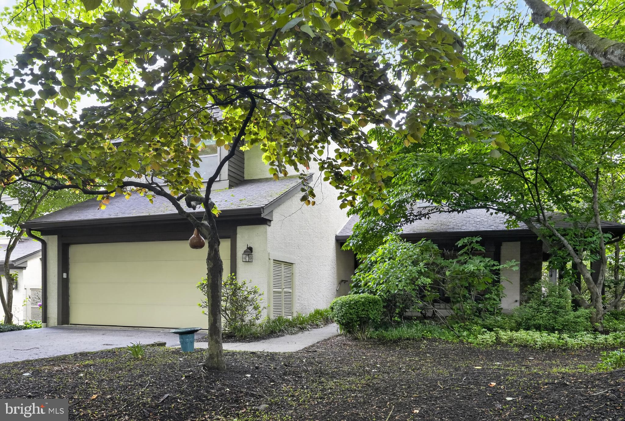 Welcome to the hidden gem of the sought-after Ponds section of the desirable Chesterbrook community, located within the award-winning Tredyffrin/Easttown School District. Tucked away at the end of a quiet cul-de-sac, 507 Kettlehouse Pond offers the perfect blend of privacy, serenity, and low-maintenance community living. This beautifully maintained 3-bedroom, 2.5-bath end-unit townhome is surrounded by peaceful wooded views and lush garden spaces, creating a tranquil retreat to call home. Step inside to a grand two-story foyer that opens seamlessly to all of the main living spaces, showcasing the home’s spacious and open floor plan designed for both comfortable everyday living and effortless entertaining. The inviting living room features cozy carpeting, a gas fireplace, ceiling fan, and picturesque views of the private deck and wooded backdrop. The living room flows directly into the spacious dining room, complete with sliding glass door access to the back deck, making indoor-outdoor entertaining a breeze. Just beyond is a room that can be used as a cozy family room or an eating area. It offers a second gas fireplace, access to the deck, and opens directly into the kitchen, creating the ideal gathering space. The kitchen boasts ample cabinet and countertop space, an island with additional storage, and no shortage of pantry space thanks to the oversized pantry and convenient mudroom area. A half bathroom completes the main level. Ascend upstairs to the spacious primary suite, featuring plush carpeting, a window seat with storage, a large walk-in closet built by Closets by Design, and a private ensuite bathroom. Two additional bedrooms are located on the second level. One is home to the laundry, which is located within the closet, for added ease in everyday chores. The other is spacious, and boasts windows on both sides that face trees and your wooded surroundings. These bedrooms have easy access to the full bathroom down the hall. A bonus room currently serves as a private home office, offering flexible living space to fit your needs. The partially finished basement adds even more versatility, featuring a spacious art room, cedar closet, and extensive unfinished storage areas throughout 2 rooms, one with built-in shelving systems to keep everything organized. Enjoy peaceful summer evenings relaxing on the charming wraparound porch or unwinding on the private TREX back deck while taking in the serene wooded surroundings. Buy with peace of mind knowing the home includes a newer AC system installed just last year and backed by a warranty.  All of this while being conveniently located near local shopping, dining, and major commuting routes including Rt. 202 and the Pennsylvania Turnpike. This is a rare opportunity to own in one of Chesterbrook’s most private and picturesque neighborhoods. Welcome home!