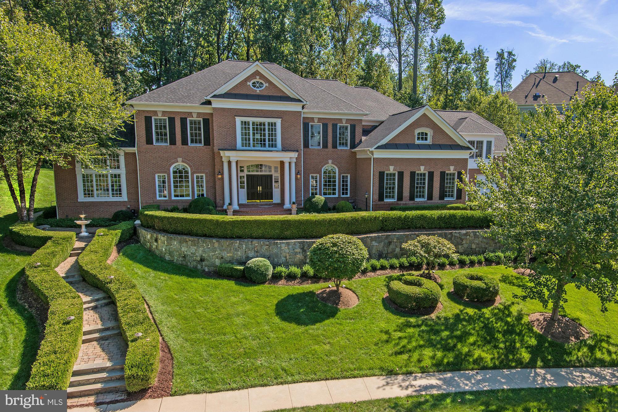 Stunning brick residence in highly desirable RESERVE on premium lot!  Perfect for family living or grand entertaining. Highest finishes found throughout w/ extensive updates! Offering sun filled public rooms, wonderful family room, gourmet kitchen, library, luxurious master suite, bonus suite above garage & more. Lower Level offers theater, game, & rec room.  Whole house generator! 4-Car Garage.