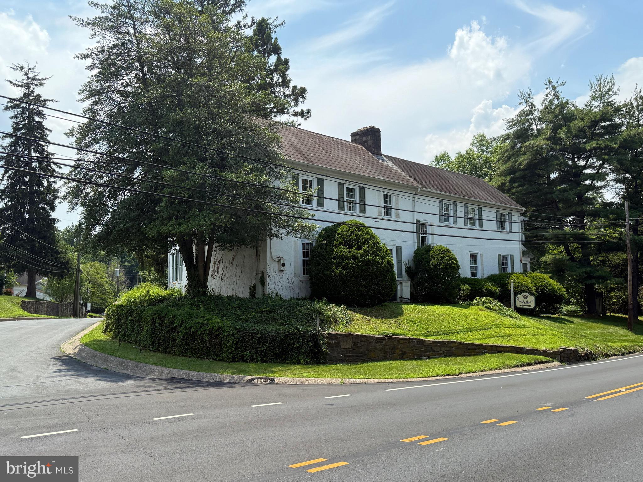 Incredible development opportunity in the heart of New Britain Borough. 10 Beulah Road offers a rare combination of location, zoning flexibility, and buildable land with strong frontage and visibility. The property spans 2.44 acres and features a freestanding commercial building measuring just over 7,500 square feet. Positioned on a corner lot with frontage on both Route 202 and Beulah Road, this site benefits from exceptional exposure and access, ideal for future residential or mixed-use development.

Zoned C-3 Office Commercial with a Mixed-Use Overlay, the property supports a wide range of potential uses, including residential, commercial, and mixed-use configurations. The building is currently occupied by month-to-month commercial tenants, allowing flexibility for redevelopment or holding income during the planning and entitlement process. Copies of leases, building sketches, and an estimate for public water hookup are available upon request.

The seller has conceptual site plans and sketches illustrating the maximum density of townhome units that may be achievable under current zoning — an ideal starting point for builders and developers looking to enter the highly desirable Doylestown-area market. With its location just minutes from downtown Doylestown, Delaware Valley University, and major commuter routes, this site is exceptionally well-positioned for long-term growth and development.