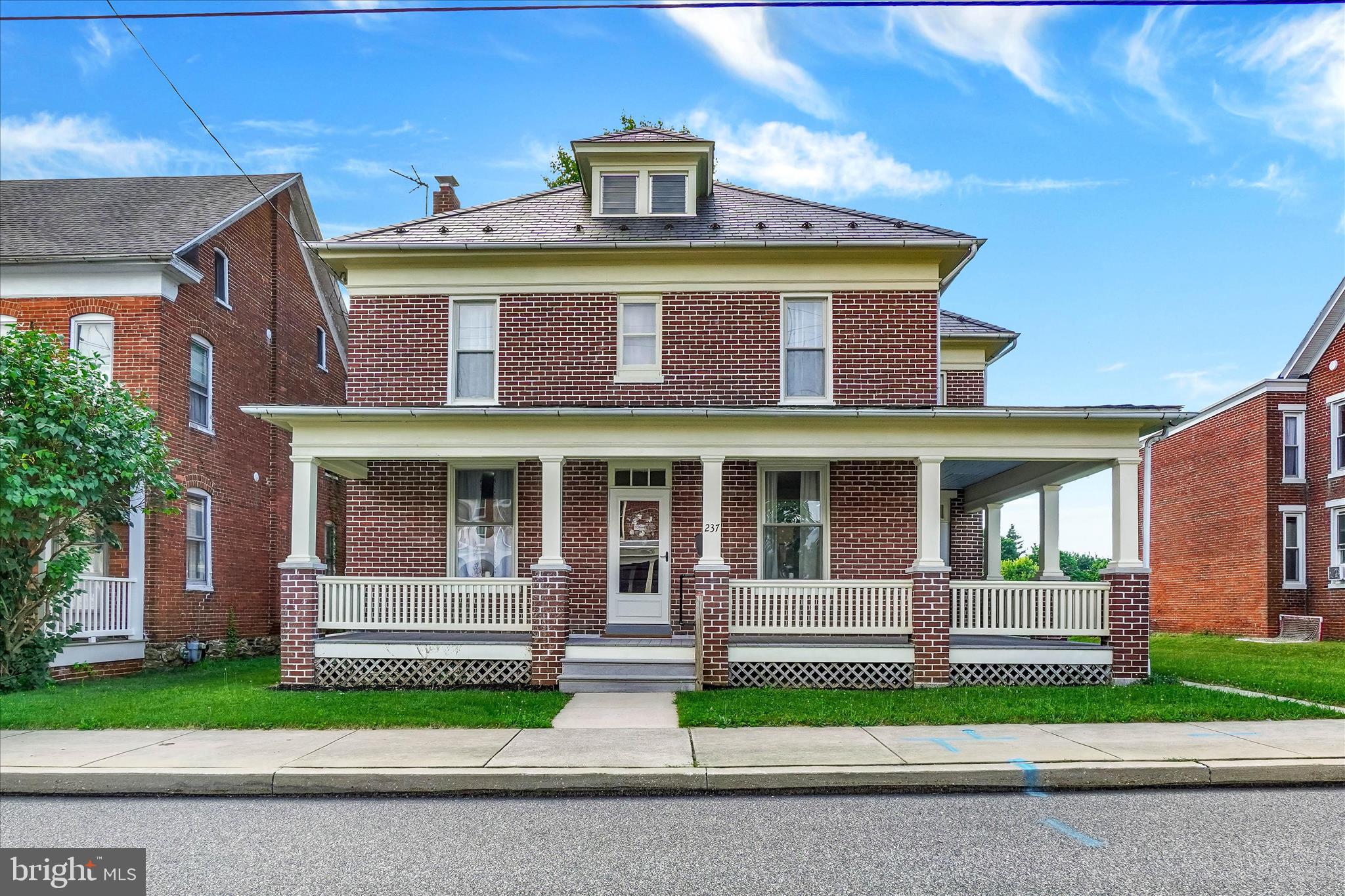 Solid brick home in Dallastown schools has been completely renovated with new kitchen, baths, and butler's pantry. Built in 1915,  the home has high ceilings and beautifully restored trim and doors throughout.  With 4 bedrooms, 2 baths, new flooring, fresh paint, and a 2 story oversized 1 car garage, this home checks a lot of boxes.  Open house the SATURDAY June 20th from 11-2. You bring the iced tea, we'll bring the porches!!