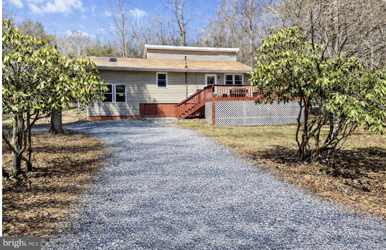 This 3 bedroom/2 bath home located in Indian Mountain Lakes offers a flexible Layout and bright open living space and natural light throughout. The eat in kitchen provides functional space for everyday use and easy access to the main living areas. The home featured multiple Versatile areas that can be adapted to suit a variety of needs, offering flexibility for additional living, working or guest space. Located in an STR friendly amenity-filled community with lakes, pools. and recreational options, this property is well suited for a primary residence, vacation home or investment. Sellers are ready to hear all offers!!