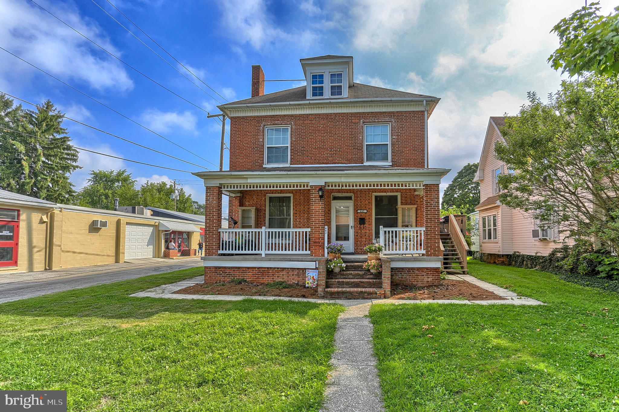 Have the tenants help pay your mortgage!  This would be a perfect house for owner occupants on the first floor and current tenants on the 2nd floor.  ***The first floor is a large apartment with a large L-shaped  open living/dining room combo with a fireplace with gas logs and built-in cabinetry.  Eat-in kitchen.  2 large bedrooms.  Remodeled bath with a whirlpool tub and separate shower.  Gas heat and central air.  Basement with a partially finished room.  ***The 2nd floor 2 bedroom apartment has been newly remodeled with new vinyl plank flooring through-out, a new kitchen and remodeled bath.  Walk up attic. 3 new window a/c units included.  ***Fenced yard.  24 x 24 two car garage and a 12 x 28 one car garage both with alley access.  ******First Floor tenants pay $925/month but are scheduled to  be out by Sept. 30.  Second Floor tenants have a yearly lease in place until May for $825/month.  Seller's business currently rents the garages for $180/month.  Landlord pays water/sewer/trash.  Tenants pay gas and electric.