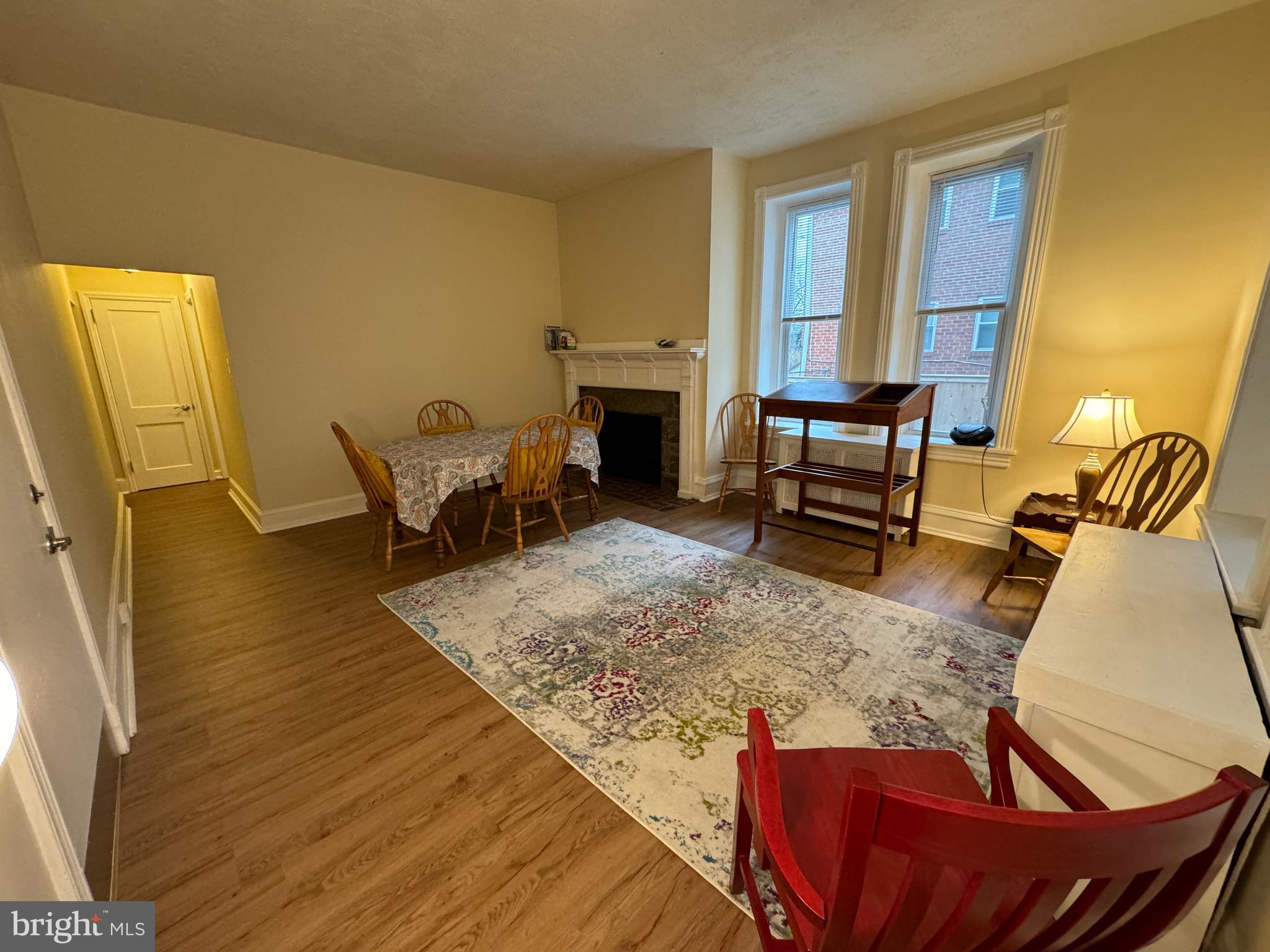 THIS PROPERTY IS NOT APPROVED FOR STUDENT HOUSING. Welcome to #1W in a 4-apartment multi-unit building with an inviting front porch and beautiful common area spaces and gardens, which can make apartment living have more of a homey, single family home feel. This spacious 2 bedroom 1 bathroom approximately 1,000sf apartment has 10' ceilings in the living spaces, tall windows and exquisite moldings and extra high baseboards creating a wonderful comfortable living environment. The property has recently been renovated with luxury vinyl plank flooring and newer updated kitchen with white cabinets and newer stainless steel appliances. Enter the front door and there is a living room/dining area with a beautiful fireplace (non-working) focal point. The kitchen is spacious with room for a breakfast table. Two light-filled bedrooms are serviced by a renovated hall bathroom. The first bedroom has two large closets. The second bedroom has a door to a rear deck where one can sit and enjoy the rear yard of the property. There is in-unit laundry. There is an additional secure storage area in the basement level. The garage is detached and has a garage door opener. All windows have recently been replaced for improved energy efficiency. Landlord will be installing additional heat/AC splits in the two bedrooms for supplemental heat and air conditioning. Landlord supplies window ACs for the front room and kitchen. Please note the rent includes: all maintenance, by a very hands-on landlord/owner, water, radiator heat, snow removal and landscaping. Tenant pays for gas for cooking and heating of water, but not the gas that fires the boiler for the radiator heat.  This is a wonderful opportunity to live in a new apartment in a charming home-like building on a bucolic street in a convenient walk to town location and all the local amenities such as the R5 train, local parks, public schools (Gladwyne Elementary, Black Rock Middle School and Lower Merion High Schools), private schools (Haverford, Shipley, Baldwin, etc.) and universities such as Rosemont, Bryn Mawr and Haverford College with its extensive walking trails.