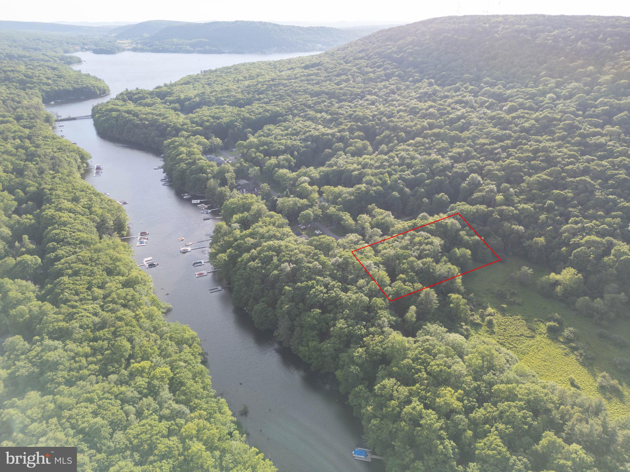 Rare opportunity to own a split-Lakefront Lot in a no-wake zone cove with Type-A private dock eligibility and access to public sewer. 100 feet of lakefront. 1 acre lot is mostly level with gradual slope to the water. Quiet road less than one mile from the Deep Creek Lake State Park. Type-A dock eligibility is very difficult to come by for unimproved land. $6500 ERU for sewer has been paid by seller. Call today to find out how you can make this your future homesite!