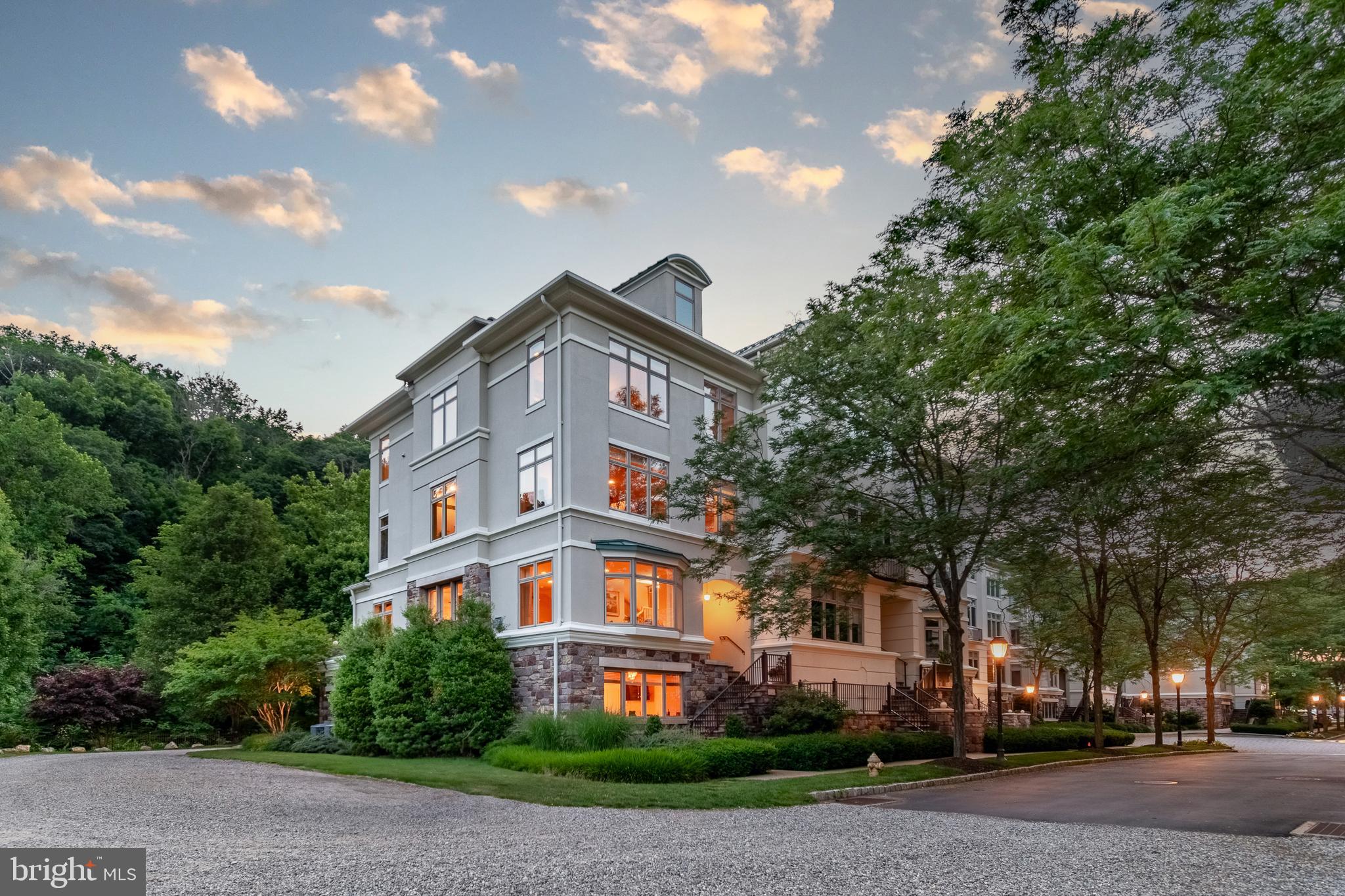A stunning end-unit townhouse offering an unparalleled living experience awaits its next lucky owner in Waterview Place. With south-facing unobstructed views of the Delaware River, the picturesque Towpath, and the serene canal, this four-level townhouse captures the essence of riverfront living. Within a few blocks of New Hope’s vibrant downtown district with theater, renowned restaurants, and charming shops, it is ideally situated to enjoy the best of Bucks County. The location alone sets it apart, but it’s the attention to detail and luxurious finishes that truly elevate this home. In-lay angled Brazilian cherry floors stretch across the common rooms, all elegant and inviting, featuring furniture-style built-in buffet cabinets and a cozy gas fireplace. with a hidden tv above.  The kitchen is a chefs dream, equipped with high-end appliances, granite countertops, a paneled Sub-zero refrigerator, Jenn Aire ovens, gas stove top w/downdraft vent and a Miele dishwasher. It seamlessly flows into the dining area and opens to a vast terrace, complete with an awning and a natural gas line hookup for a grill making outdoor dining and entertaining a breeze. An elevator provides easy access from the ground-level oversized two-car garage to all levels, culminating in the sprawling primary suite on the fourth floor. The guest bedrooms and a home office, along with two bathrooms, are located on the intermediate floor, ensuring privacy for all. The top floor is a sanctuary, with the primary suite serving as a luxurious retreat. This space is designed for ultimate relaxation and indulgence, featuring a vast bedroom, a true sitting room, and a huge en suite bathroom with a laundry/walk-in closet and an additional spacious walk-in closet. Hands down, this townhouse boasts one of the best locations in Waterview Place. The combination of its stunning views, it’s fine finishes, and its proximity to New Hope’s attractions is sure to please even the most discerning buyer.