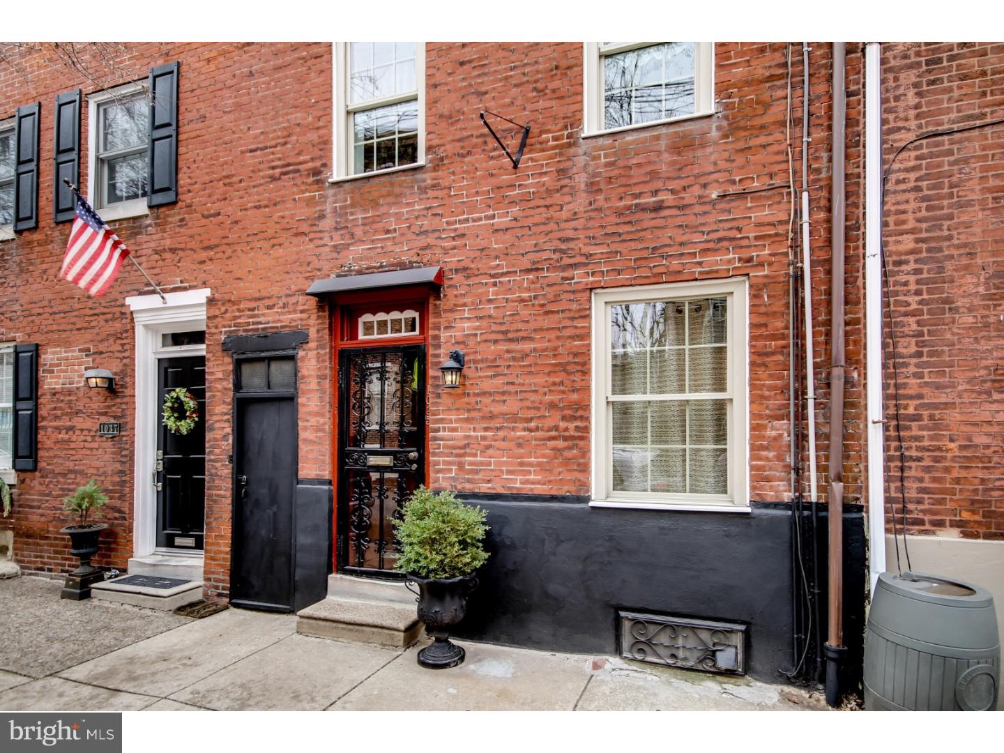 A charming 3-story brick row house, 2 bedrooms plus den, 1 bath in the heart of Northern Liberties. Nice sized rooms, private enclosed back yard, refinished original hardwood floors throughout, and a brand new roof in 2015. Also features a newer energy efficient door and double-hung tilt-back windows, solid wood interior doors, a decorative fireplace with trim, gas heat/hot water, gas cooking, and central air. Step through the refinished solid wood entry door to your freshly painted living room with original hardwood floor, coat closet and open view into kitchen and backyard. Kitchen has exposed original brick walls, crown moulding, large window overlooking backyard. Gas stove, refrigerator, dishwasher, and garbage disposal included. On the 2nd floor, you'll find a large, bright bedroom with beautiful original hardwood floors, closet, built-in bookcase and fireplace; a cozy den with closet and original hardwood floors; and a tile bathroom with decorative window and jacuzzi tub/shower. Upstairs is bright and spacious 3rd floor bedroom with vaulted ceiling, skylights, ceiling fan, original hardwood floors, 2 closets including a large walk-in closet and plenty of loft storage. Downstairs is a full-height, unfinished basement with washer/dryer, laundry sink, storage cabinets and shelving included.