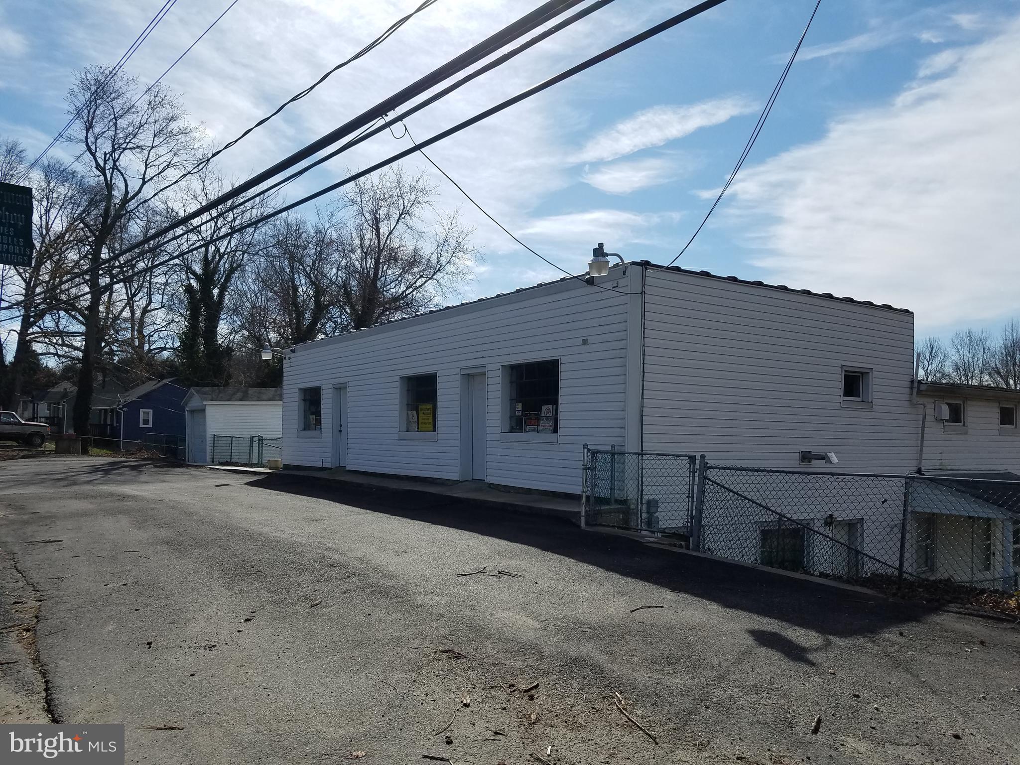 B1 zoning (business or retail use) with 2600 sq ft open space on main level (2 separate areas w/1 half bath).  3 floors each level has separately metered electric and hot water. Lower levels are currently being used as 2 rental units w/ separate ent (2 br+ and efficiency unit) could also be converted into office space.  Large unit brought in $1,000 a month and the smaller unit brought in $750 a month.   Additional storage within the building and outside. Located within 1 mile I-95.