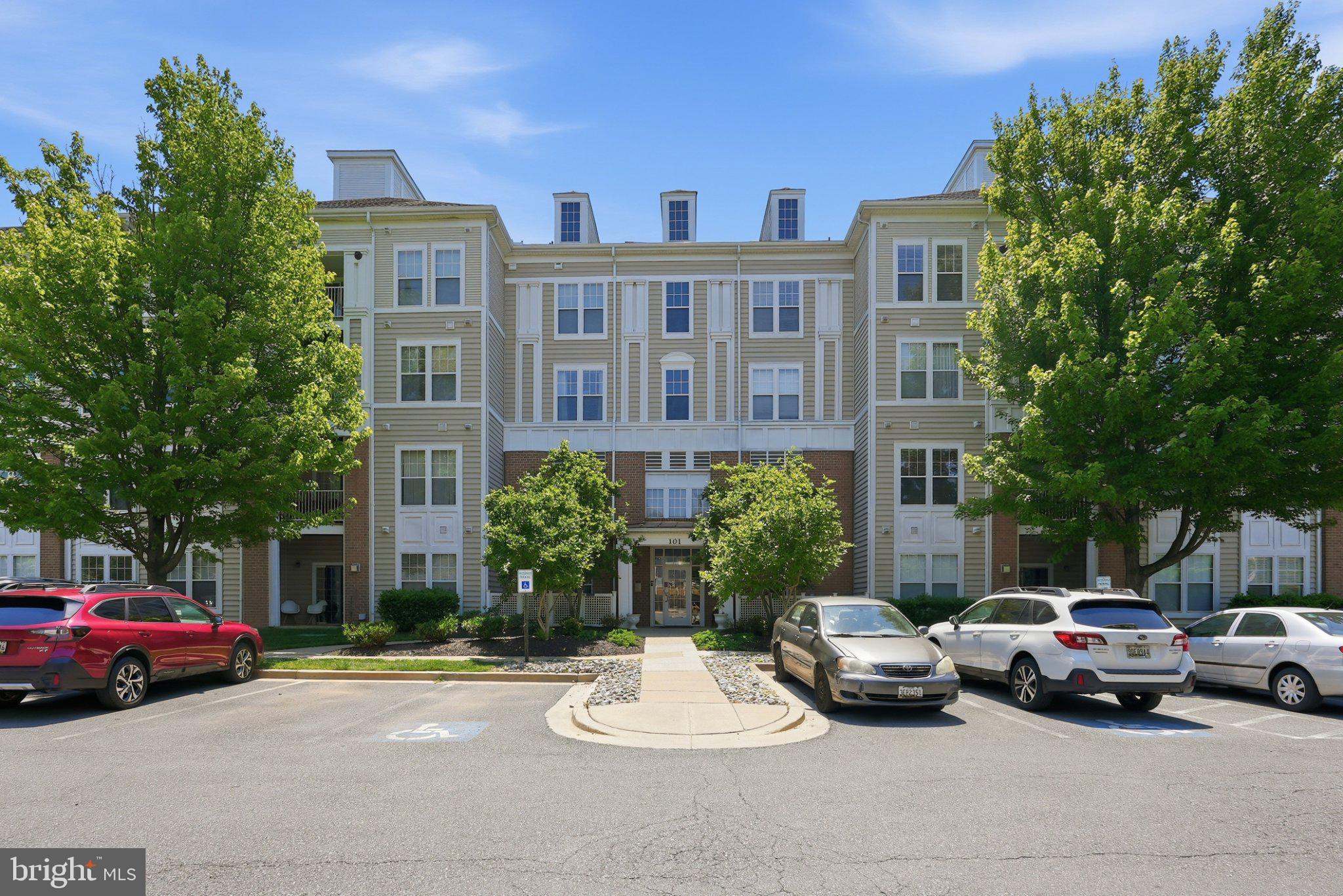 Light bright open 2 bedroom condo in King Farm includes separately deeded garage space.  Huge entry way leads to living room w gas fireplace and door to the balcony door.  Redone kitchen w/ stainless steel appliances, including a gas powered stove and eat in table space.  Walk-in pantry and den off kitchen. The large primary bedroom features a walk-in closet, bathroom featuring separate shower/garden tub.  Secondary bedroom w/ a redone hall bath. New hvac 2023, dishwasher 2024, den/kitchen flooring 2024, hot water heater 2025. In the heart of the neighborhood- walkable to grocery store, park, tennis and basketball court.  Neighborhood shuttle to metro right outside building!  Includes oversized 1 car garage (7c) that is included on another deed.