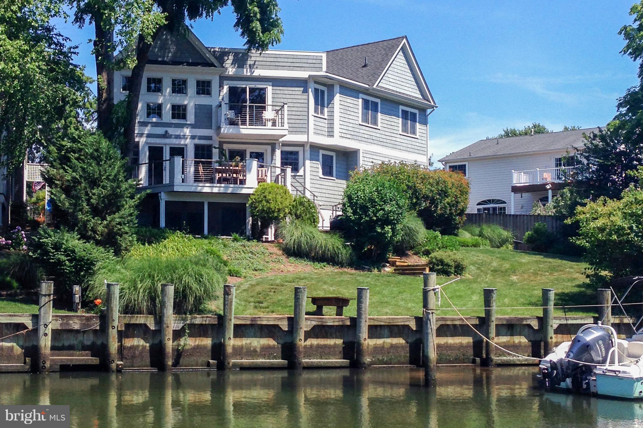Coastal waterfront contemporary off Spa Creek.  Walk to Eastport shops, restaurants and downtown Annapolis.  3 finished levels with open floor plan and walls of windows.  Hardwoods on 1st and 2nd floor, new kitchen & luxurious master bath.  Hardi- shingle exterior, Ipe decks, screened porch, 2-car garage.  Gentle sloping lawn to deep water dockage -- hop in your boat for quick spin to City Dock!