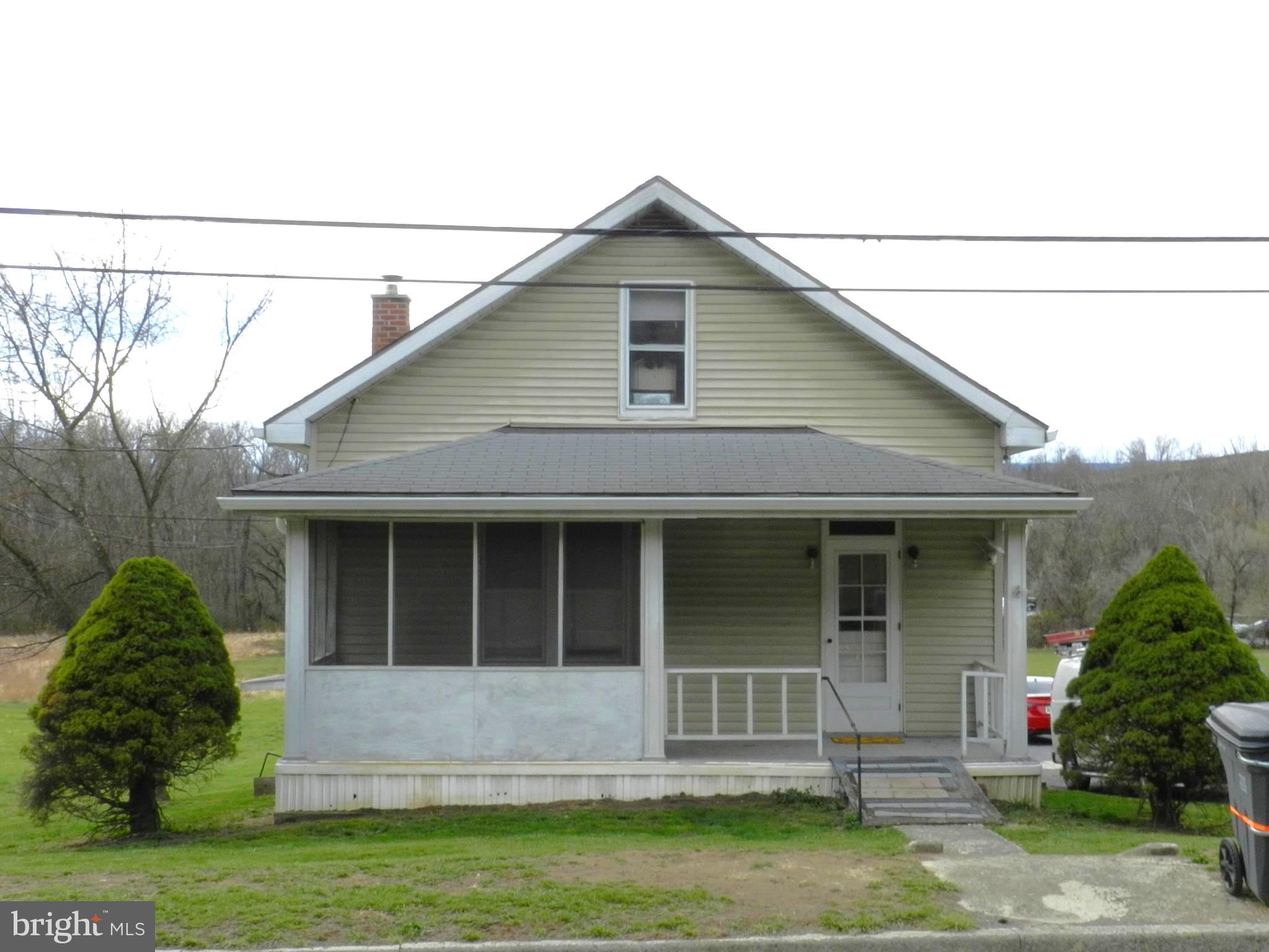 All offers due by Sunday 04/06 at 6pm.  Move right into this charming, well-maintained home on a spacious lot with a great backyard! The main-level bedroom and bath offer convenience, while the fully equipped kitchen overlooks the backyard, making it easy to stay connected while cooking. Upstairs, you'll find a huge walk-in closet with built-in shelves, perfect for all your storage needs. Need even more space? The basement has plenty of room, too. With nothing to do but unpack, this is a fantastic opportunity to own for less than renting.