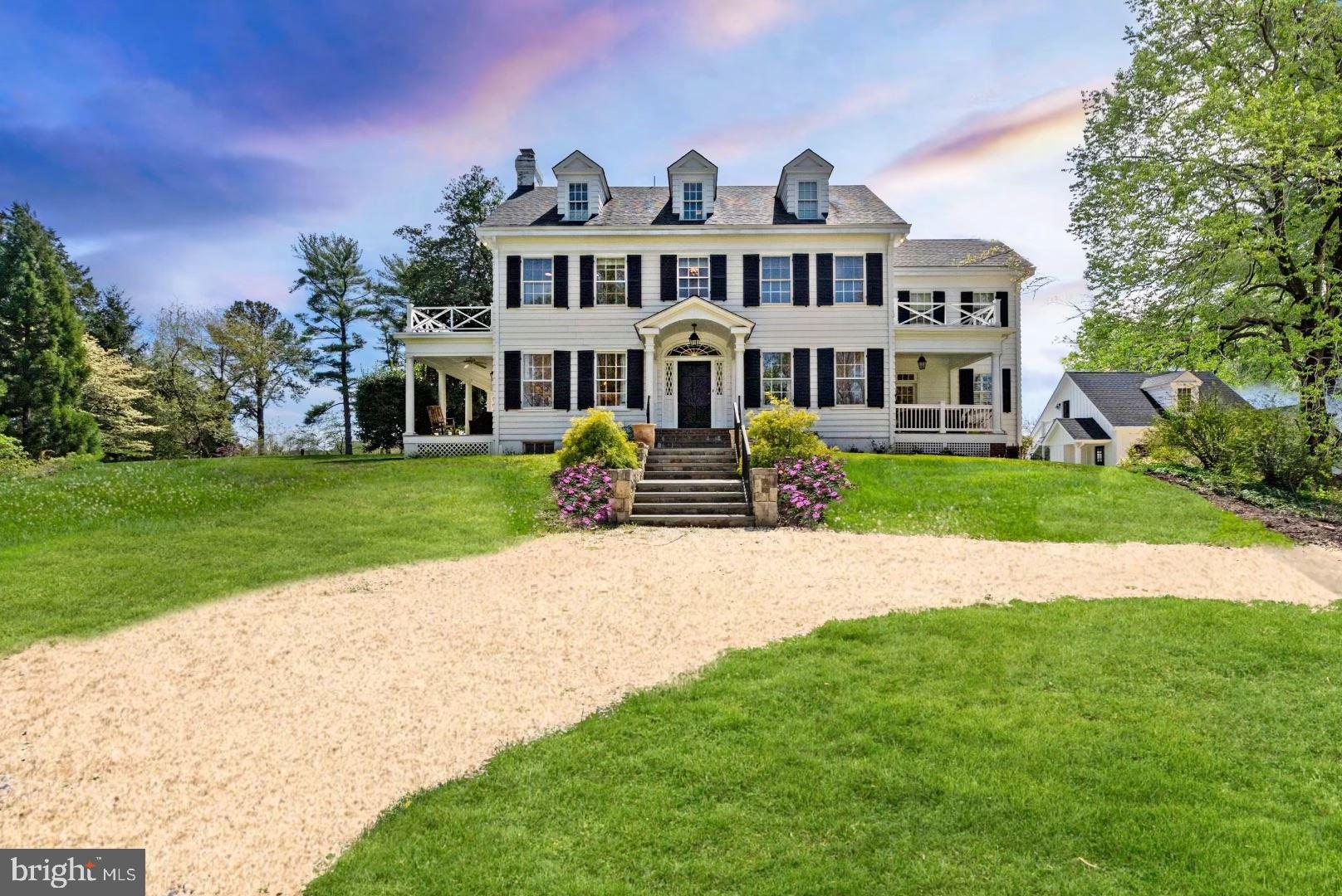 This charming, sun drenched Colonial was originally built in 1921 and completely renovated with modern conveniences throughout in 2014. Perfectly sited on one of the highest points in McLean with panoramic views and 4.34 picturesque acres on tranquil Pine Hill Road. This charming estate is surrounded by mature landscaping and gardens providing unsurpassed privacy and a walking path to Downtown McLean. The comfortable interior, with beautiful spaces, has a welcoming Foyer that opens to the elegant Formal Living and Dining Rooms that have French doors leading to side porches. The Family Room features coffered ceilings, fireplace, a wall of windows and French doors allowing for seamless indoor/outdoor living. The Family Room opens to the chef's Kitchen that has custom cabinets, large center island, farmhouse sink and top-of-the line appliances. A cozy Breakfast Room is surrounded by windows with bench seating and French doors to the Patio. The Main Level also includes a Butler's Pantry with a beverage fridge, Office with built in desk, Mud Room, Laundry Room and screened-in-porch with a stunning stone fireplace and vaulted ceilings. The Upper Level has a wonderful Owner's Suite with vaulted ceilings, two walk-in Closets, a gorgeous spa Bath featuring separate vanities, a stand-alone tub and shower.There are 2 En-suite Bedrooms and a Sitting Room on the Upper Level and 2 more Bedrooms with a full Bath on the 3rd Level. Relax in the Basement that boasts a Media Room, Game Room,Bedroom and full Bath. The Carriage House offers a 2-car Garage and upper level space for all your hobbies or workshop needs as well a detached shed. This amazing property with its character and charm will exceed your expectations!