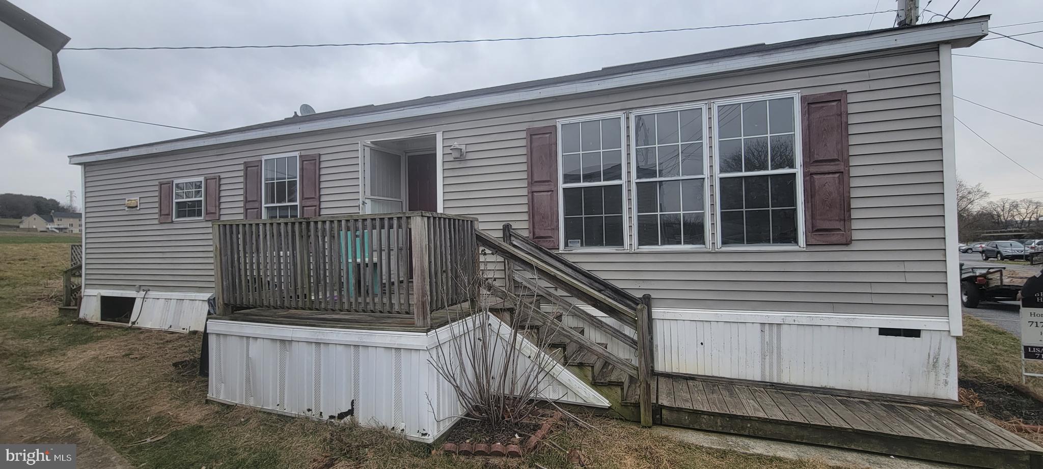 Spacious 3BR & 2FBath  1990 Doublewide in Conestoga Manor Mobile Home Park. Freshly painted interior & new flooring throughout! Nice kitchen with light maple-stained wood cabinets, solid surface countertops & breakfast bar open to the dining area. New Refrigerator & Stove! Large living room with ceiling fan & 3 windows allowing for lots of natural light. Primary Bedroom has a walk-in closet & private bath with a large vanity & walk-in shower.  There is storage shed out back & a large deck that overlooks the farm behind.  The deck & exterior needs some TLC, but could be very nice with a little work. Enjoy affordable park living with lot rent of $450/mo that includes sewer & garbage. Located just minutes to conveniences & Rt 222. Take a look today!!