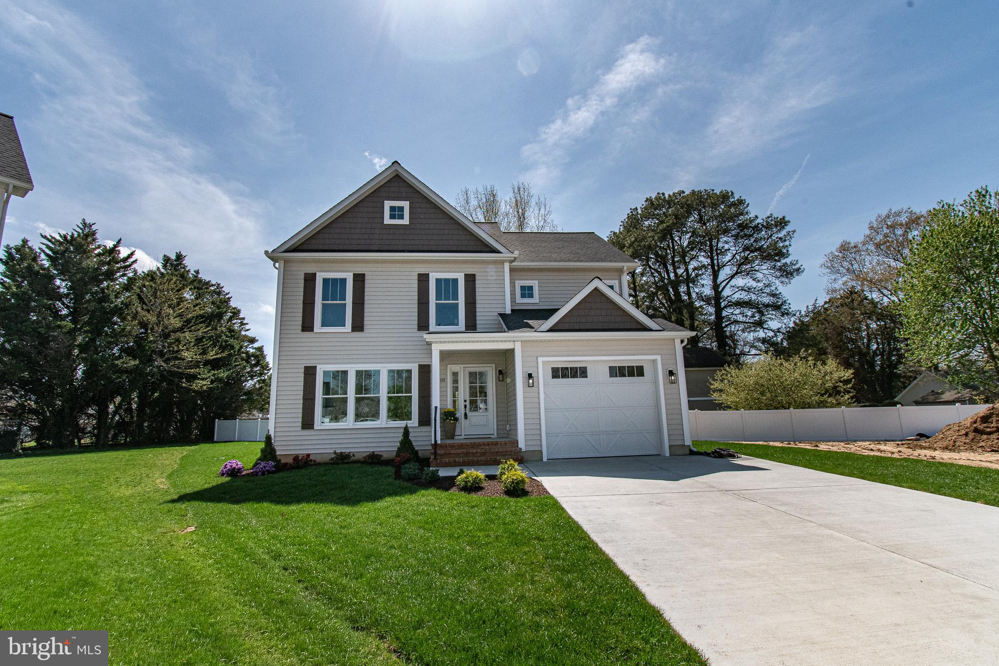 Broker and Public Open 4/23 from 10am to Noon!  OCCUPANCY PERMIT in hand, move right in! Nestled in the charming town of Easton Maryland, this exquisite new construction offers a perfect blend of modern luxury and traditional elegance.  The sixth of Sandy Lane's ten total homes to be built, this design is the first two story that includes a first-floor primary suite with gorgeous en-suite bath and a huge walk-in closet.  There are two additional bedrooms up and a 320sf family room, providing a second spacious gathering place for tv watching, reading, homework, pool table, games, the works!  It is a thoughtfully designed custom layout providing plenty of space for privacy, relaxation and entertainment. Step inside to discover an inviting open floor plan that seamlessly connects the gourmet kitchen to the dining and living areas. The kitchen as designed is a cook's dream, with an island providing ample workspace and seating for four.  The kitchen is equipped with custom cabinetry and elegant countertops as well as stainless appliances. The kitchen island serves as a focal point for gatherings, while recessed lighting and ceiling fans enhance the ambiance throughout the home. The interior is fitted with luxurious vinyl plank flooring and carpeting, creating a warm and comfortable atmosphere. The first-floor primary suite features a huge walk-in closet and a private, beautifully finished bathroom with a custom-tiled shower.  Next to the interior entrance to the garage, you will find a convenient, dedicated laundry room and private powder room.  Outside, the property is equally impressive. The extensive hardscape and beautifully landscaped front yard create a picturesque setting, with a rear patio and front porch perfect for outdoor entertaining or quiet evenings spent enjoying the neighborhood views.  In addition to an encapsulated and climate-controlled crawl space, features include energy-efficient double-pane windows, Certified IECC Energy Efficient insulation (R-49 ceiling, R 21 walls), exterior lighting, and a well-designed gutter system, ensuring both functionality and aesthetic appeal.  Whether you are retired, work from home or have a growing family, this flexible floorplan will suit your needs. Parking is a breeze with an attached garage with electric car charger, driveway space for two vehicles, and additional on-street parking available. Located on a cul-de-sac, this home offers a sense of privacy while still being in the heart of downtown, where the vibrant community life of Easton awaits.  You can experience the luxury of modern living in a prime downtown Easton location, where every detail has been meticulously crafted to provide comfort and elegance. Don't miss the opportunity to make this stunning residence your own and enjoy the exclusive lifestyle offered on Sandy Lane.  Sandy Lane homes are subject to recorded Covenants and Restrictions (attached in docs) but there is no HOA or fees.  Developer: Sandy Lane, LLC, MHBR 9512.  Builder: Stansbury and Sons Home Improvement Inc., MHBR 8351. BUILDER CONTRACT REQUIRED.