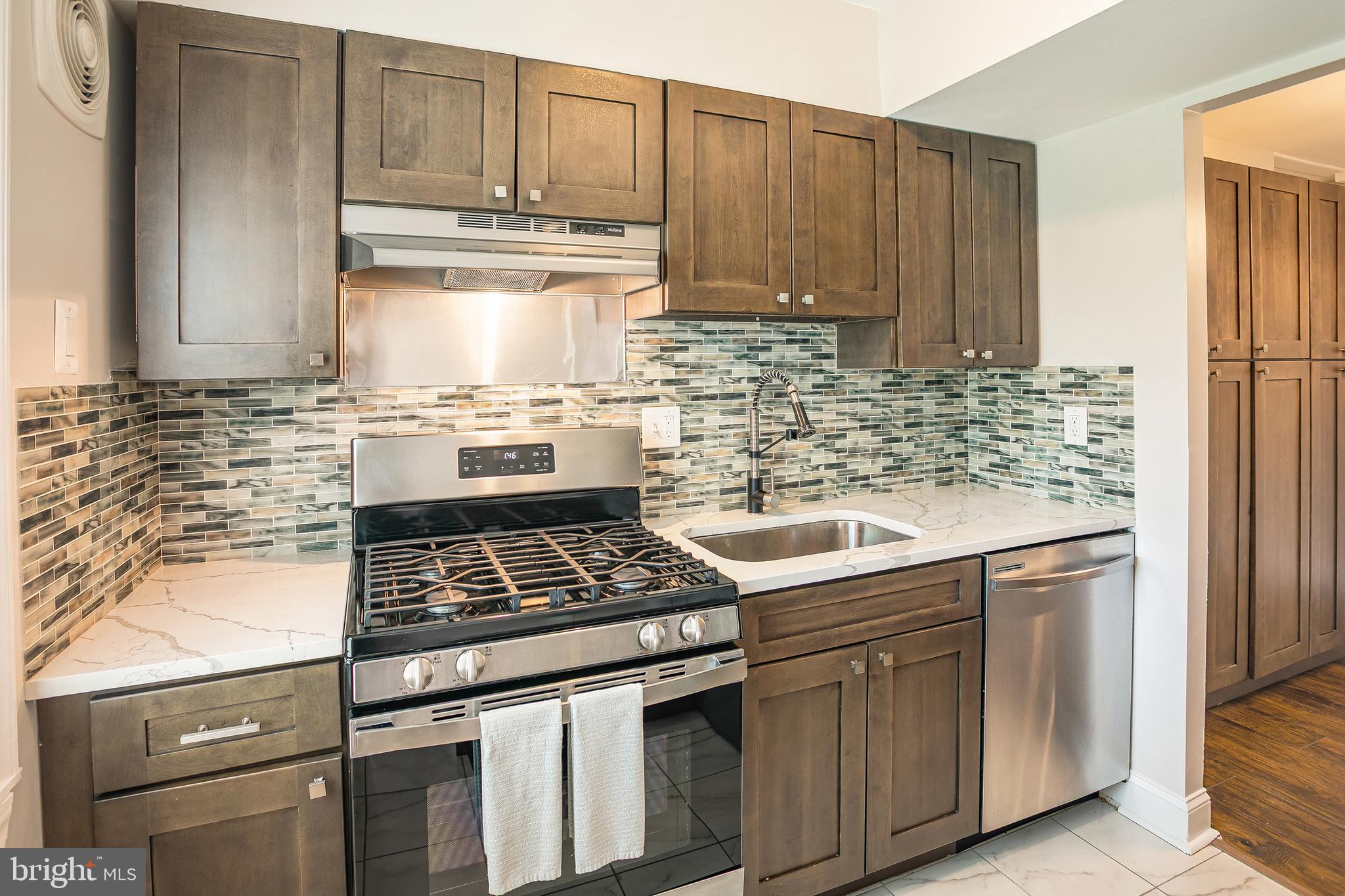 Welcome to 9495 Fairfax Blvd Unit 103, a beautifully refreshed condo in the heart of Fairfax that perfectly blends modern updates with everyday convenience. As you step inside, you will immediately notice the fresh paint throughout the home, creating a bright and inviting atmosphere that feels brand new. The living space flows seamlessly into the dining area, which has been thoughtfully enhanced with custom built-in stacked cabinets for significant extra storage. 

You can step out onto your private walk-out patio from the living area, which offers gorgeous views of the expansive green common grounds, a serene backdrop for your morning coffee or evening relaxation. Both bathrooms have undergone recent renovations, featuring contemporary finishes that offer a clean and polished look. Beyond the cosmetic upgrades, this unit provides essential peace of mind with a full electrical panel upgrade completed in 2024. 

The lifestyle here is defined by simplicity and ease, as the monthly condo fee includes all utilities like electricity, gas, and water, allowing for predictable and stress-free living. In addition to the ample interior space, the unit comes with a separate storage area to keep your living environment clutter-free. Located just minutes from the vibrant dining and shopping of Old Town Fairfax and offering easy access to major commuter routes, this move-in-ready home is an exceptional opportunity for anyone seeking comfort and value in a prime location.