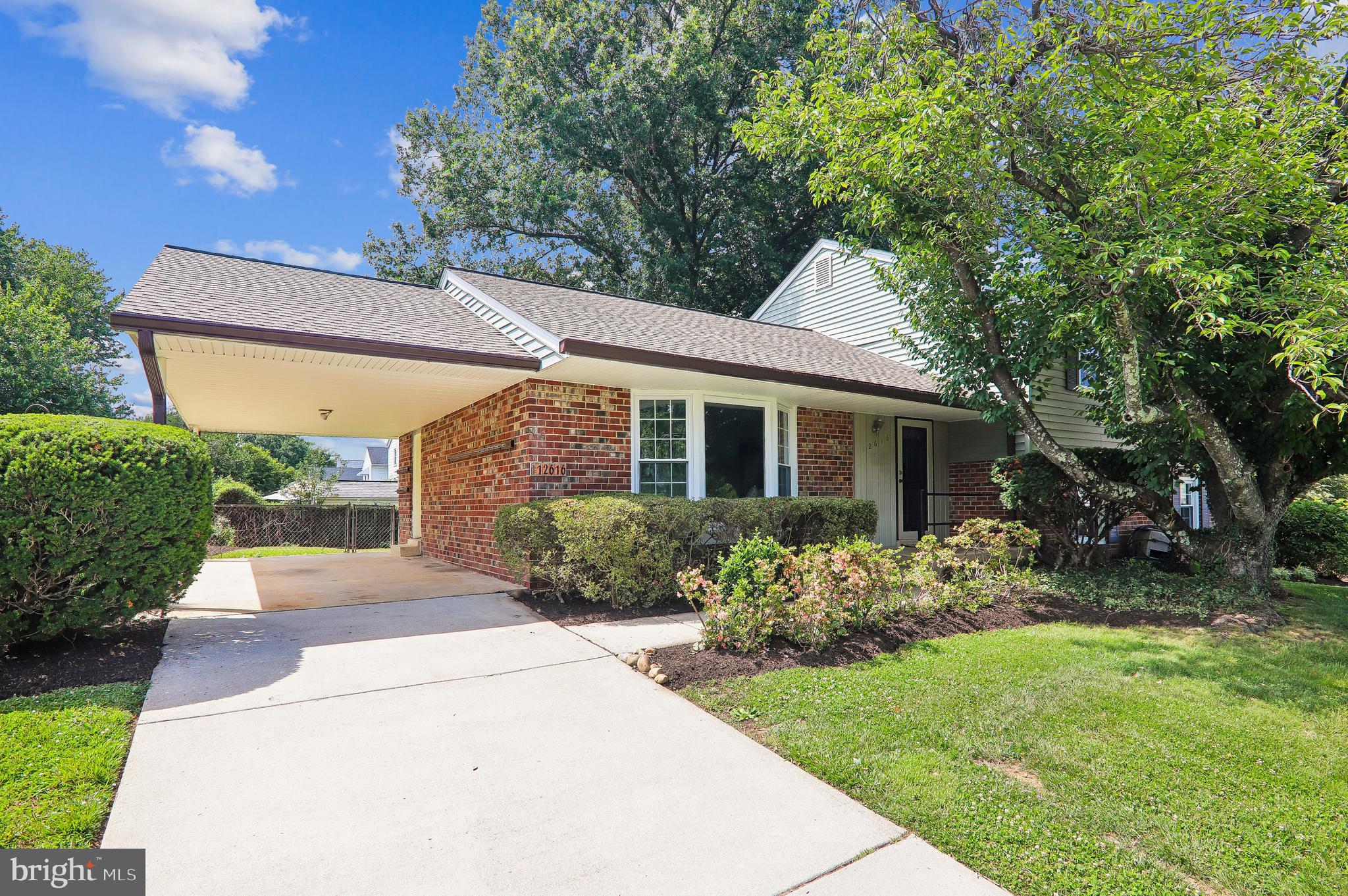 Well-maintained 4-bedroom, 2.5-bath four-level split offering approximately 2,930 total square feet across four levels on a .285-acre fenced lot with a carport and driveway. Recent improvements include fresh interior paint, including the utility room and lower-level floors (2026), refinished hardwood floors throughout the living room, dining room, upper-level hallway, stairs, and all four bedrooms (2026), new carpet in the family room (2026), new flooring in the powder room (2026), family room sliding glass door (2026), roof, gutters, and downspouts (2025), attic insulation (2025), updated exterior electrical connection and breaker box (2024), water heater (2022), replacement windows (2022), gas HVAC system and furnace humidifier (2021), and upper hall bathroom renovation (2019).
The main level features a spacious living room with a large bay window, a separate dining room, and a large eat-in kitchen with abundant cabinet and counter space overlooking the backyard.
The upper level offers four bedrooms, including a primary bedroom with en-suite bath, as well as an updated hall bathroom and linen closet.
The lower-level family room features new carpet and walkout access to the backyard and patio through the recently replaced sliding glass door. Adjacent to the family room are a powder room and a large utility/laundry/storage room with a separate exterior entrance to the side yard.
The unfinished level below the family room offers excellent storage and future finishing potential.
The level, fenced backyard provides ample outdoor space for recreation, gardening, or entertaining.
Conveniently located near Route 29 and the ICC (Route 200), providing easy access to Washington, D.C., and Baltimore. Close to Orchard Center Shopping Center with Aldi, Target, Kohl's, Giant, restaurants, and other everyday conveniences.