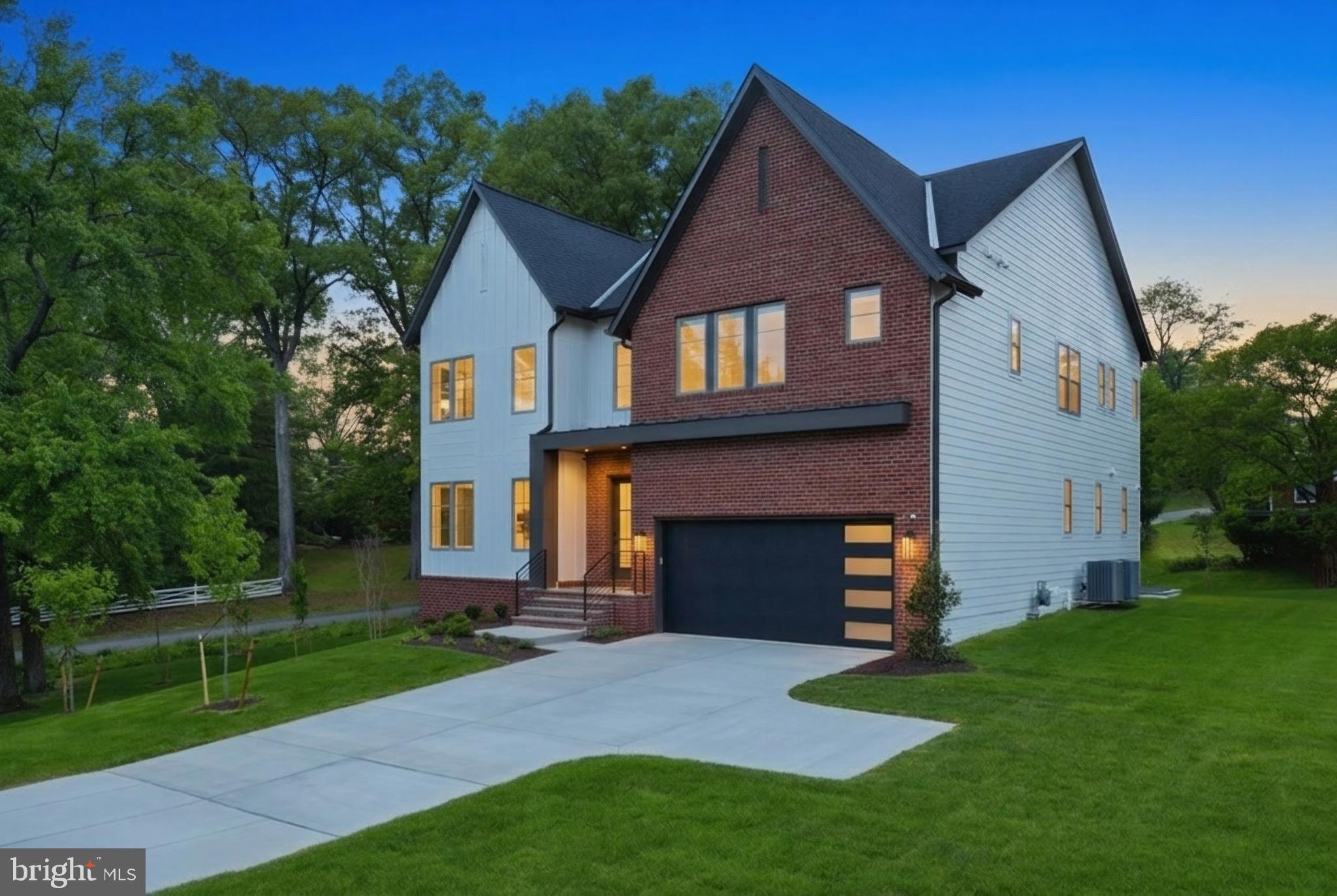 Move-in ready luxury residence in the heart of Falls Church, VA. Two additional homesites available to customize and build your dream home. Set on a beautifully landscaped homesite, this newly built modern transitional residence is one of three homes with this property serving as the Model Home. Offering over 5,500+/- square feet of refined living across three fully finished levels, it showcases a thoughtfully designed layout where clean architectural lines meet warm, high-end finishes. Buyers will also have the unique opportunity to customize finishes and selections in the remaining two homes, creating a personalized build experience within the same cohesive community. The main level is anchored by a sun-filled open layout with soaring 10-foot ceilings, wide-plank LVP flooring, and a striking linear fireplace wrapped in oversized porcelain tile. At the center of the home, the chef’s kitchen makes a statement with rift-cut cabinetry, quartz waterfall island, premium Z-Line appliances, and a fully equipped butler’s pantry—designed for both everyday living and elevated entertaining. Upstairs, the owner’s suite offers a true retreat, complete with a spa-inspired bath featuring a freestanding soaking tub, custom shower, dual vanities, and thoughtfully designed walk-in closets with built-ins. Secondary bedrooms are generously sized, complemented by designer finishes and a spacious upper-level laundry room. The fully finished lower level expands the home’s versatility with an au pair suite, full bath, expansive recreation space, and wet bar—plus walk-up access to the rear yard, creating seamless indoor-outdoor flow. Outdoors, enjoy a premium composite deck, professionally designed landscaping, and a clean, modern exterior featuring Hardie siding, brick accents, and high-performance Pella windows. Built with comfort and efficiency in mind, the home includes high-efficiency HVAC systems, smart thermostat controls, advanced insulation, and a fully integrated wiring and security system. A rare opportunity to own a thoughtfully designed, move-in ready new construction home—in one of Falls Church’s most desirable locations.