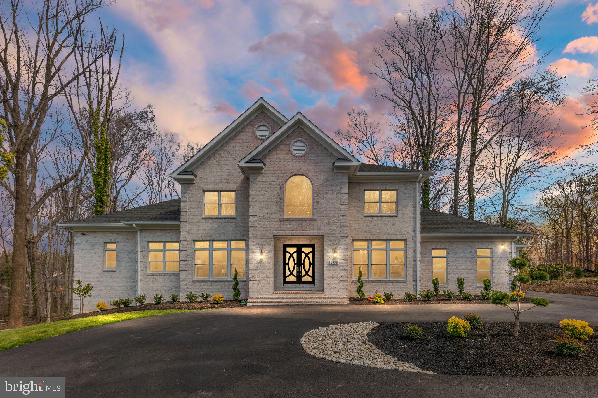 Open Sunday 1-4 PM - Immerse yourself in unparalleled luxury in this stunning new custom home boasting 5 spacious bedrooms, 6 full baths, and 2 half baths all on a beautiful .95 acre lot backing to spectacular parkland. Grand elegance greets you from the moment you step into the foyer with gleaming marble floors, a beautiful crystal chandelier & a curved oak staircase. Flowing seamlessly throughout the main level living areas are 10 ft ceilings & rich 4" oak hardwood floors, creating a warm and inviting atmosphere.  Unleash your inner chef in the gourmet kitchen featuring top-of-the-line Thermador appliances, built-in refrigerator and freezer with icemaker, 6-burner gas stove with gas 2 ovens and 2 additional wall ovens for effortless meal preparation.  Prepare culinary masterpieces on expansive countertops and gather loved ones around the large quartz island with prep sink perfect for casual meals & conversation.  Built-in microwave and two dishwashers offer the ultimate convenience & the huge pantry keeps all your culinary essentials organized.  Separate formal dining room with butler's pantry for grand entertaining.  Family room off kitchen with extensive built-ins & electric fireplace are both grand & cozy.  Luxurious sun filled first-floor primary suite boasts two massive walk-in closets, gorgeous built-in cabinets, 12 ft ceilings, & an electric fireplace. The primary ensuite bath features a double sink vanity, freestanding soaking tub, spacious shower with built-in bench, two shower heads & two separate water closets.  The upper-level hosts 3 additional large bedrooms, including another impressive primary suite with 2 walk-in closets & ensuite bath featuring double vanities, freestanding soaking tub, separate shower & water closet.  The 3rd bedroom also features a walk-in closet & an ensuite bath with a shower.  There is a large 4th bedroom & a hall bath with a tub.  Two laundry rooms, on both the main and upper level offer maximum convenience.  The finished walk out basement offers a plethora of entertainment options, including a wet bar, extensive built-in wine shelves, media room, recreation room, and a bedroom with an ensuite bath.  Additionally, there is a study with an ensuite bath, built-in cabinets & a half bath in the hall.  Luxury extends outdoors with an expansive Trex deck & an inviting brick patio conveniently located off the kitchen.  Enjoy the serenity of your pool-ready private 0.95 acre backyard, backing onto pristine Fairfax County parkland - There are approved plans with Fairfax County to add a pool & pool house should you desire! Crafted for comfort and efficiency: 40-year architectural roof ensures lasting durability, Three-zone heating system, Two 75-gallon hot water heaters guarantee ample hot water, Two humidifiers and two electronic static cleaners ensure optimal air quality, Anderson Series 400 thermal windows provide excellent insulation, 8ft solid core doors, oversized white brick on 3 sides & Hardi Plank siding in rear & an elevator shaft provides opportunity to add an elevator to access all three levels if there is a future desire/need.  Additional Highlights:  Mudroom with built-in cabinets keeps your entryway organized, 2 attached garages; one an oversized 2 car & the other an oversized one car, circular driveway, Living Room/Office on main floor, 2.2 miles to Thomas Jefferson HS.  Luxurious living awaits you.