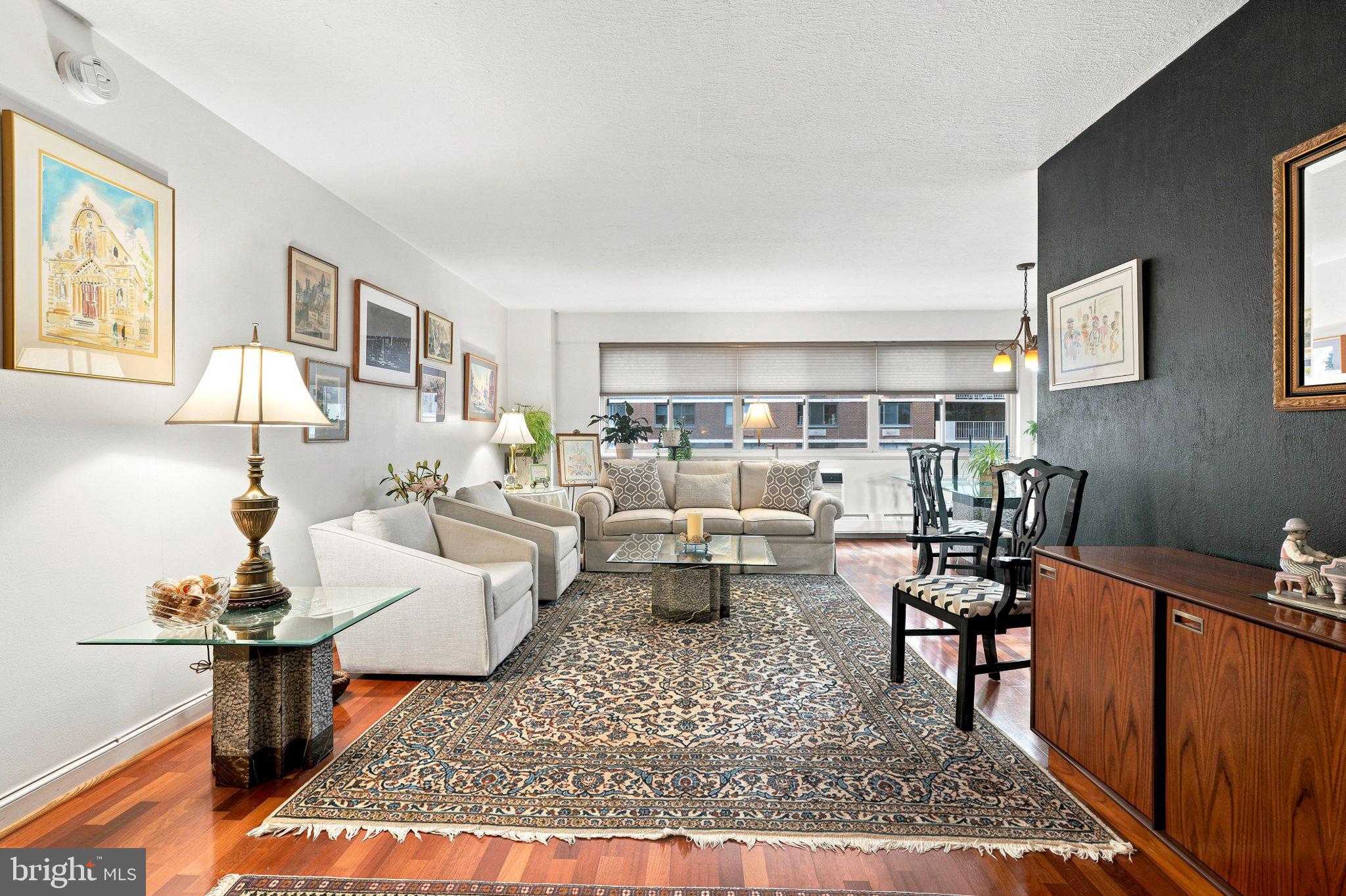 Must see to appreciate. This spacious two bedroom at Penn Center House has been cared for by the same owner for over 30 years, and it shows the moment you walk in. Clean and meticulous, with a fully updated kitchen and bath, and real hardwood Brazilian cherry floors, still in near-original condition. Unit features a dedicated laundry station with a new Bosch front-loading washer and dryer, newer AC units, and generous storage throughout including a large walk-in closet in the primary bedroom. Enjoy the best of maintenance-free living at Penn Center House, with all utilities, real estate taxes, and basic cable included in the monthly fee. Full-service amenities include a 24-hour concierge, on-site management, fitness center, community room, and a roof-deck with city views. Garage parking is available for $145/month. Penn Center is conveniently located steps from Rittenhouse Square, 30th St. Station, hospitals, universities, shopping and transportation — the best of city living. Please note: a one-time administrative fee applies for all buyers (the fee for Unit 1613 is $19,000) — see attached Buyer Requirements for co-op information and guidelines. Financing is available through Firstrust Bank; inquire within. Don't wait — schedule your tour today.