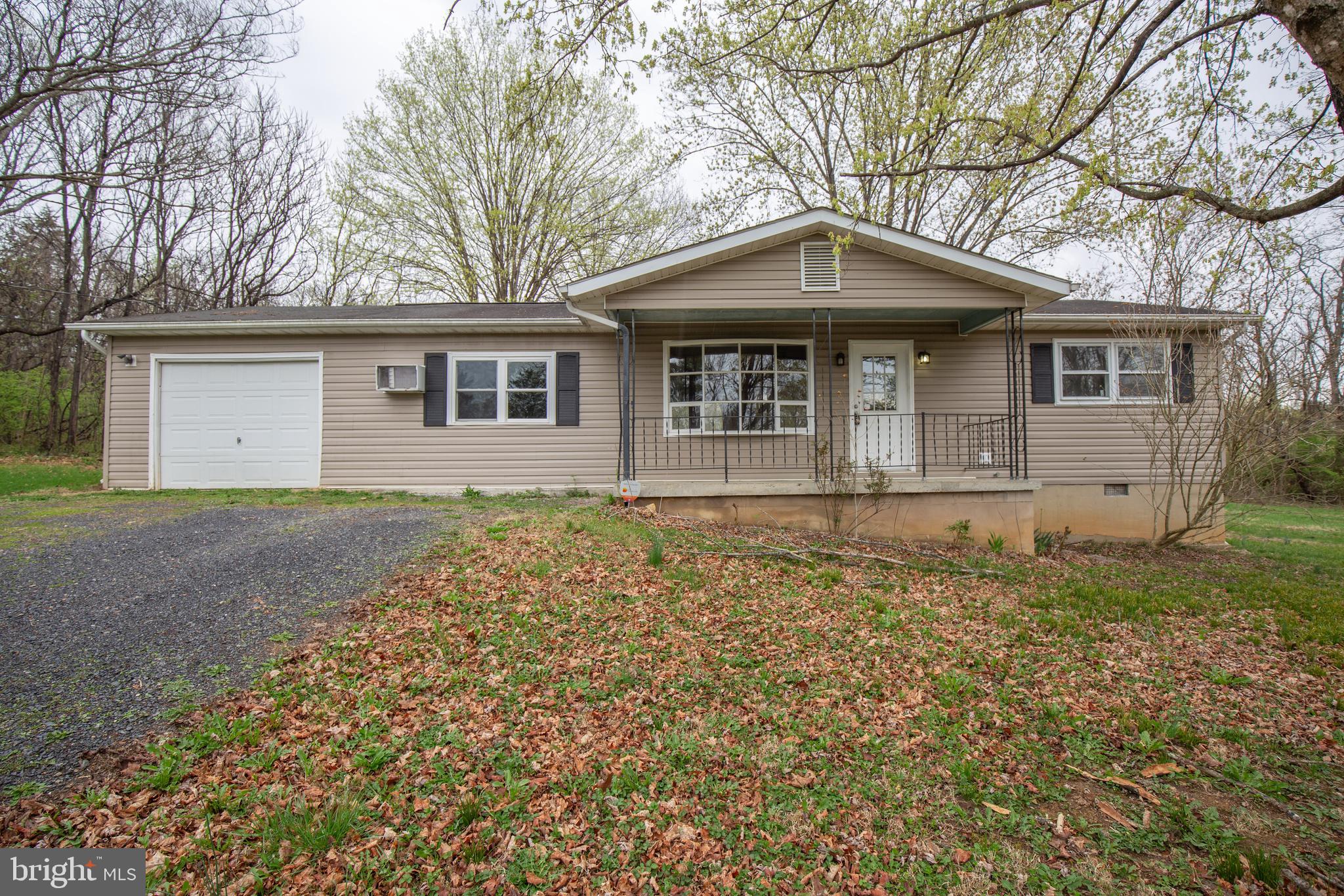 Cozy rancher on a tucked away wooded lot in the relaxing mountain setting of the Hidden River Neighborhood!

The bright, open living room with a bay window welcomes you and opens into the dining area and kitchen. The dining area has a center-hinged door that accesses the rear deck and generously sized unfenced rear yard. Off of the dining area is a large bedroom, which is conveniently next to the laundry room with full sized as-is washer and dryer and access to the rear deck and yard. 

Two additional bedrooms and a full bath are off of the living room. 

Parking is not a hassle with the large private gravel driveway and 1 car garage. 

1716 Hidden Hollow Drive is located off of WV-51 between Inwood and Charles Town; just 15 minutes from I-81 exit 5, and US-11. 

No Pets
Rent includes water and septic. Tenant(s) provide their own window units.

Additional monthly costs include Renter's insurance (price based on plan selection).