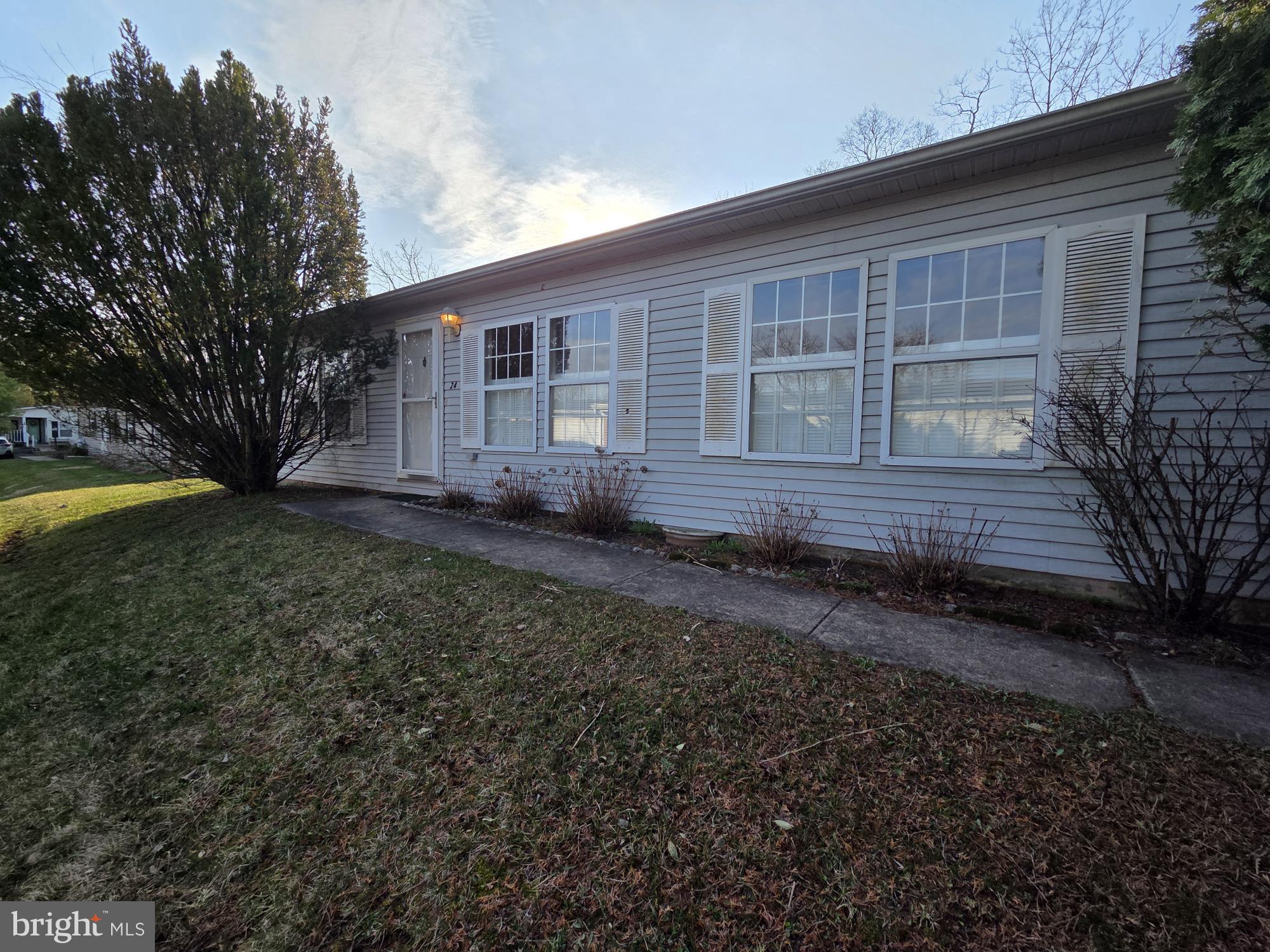 Come put your finishing touch on this 2 bedroom, 2 bath home in the beautiful 55+ community of Walnut Meadows.  This home may need work but it sits on a wonderful lot that backs up to a tree line.  Spend your days and nights enjoying nature and privacy on the back deck.  There are two nicely sized bedrooms and one and a half baths.  The home has a galley kitchen and ample closet space throughout.  The community has a large clubhouse, pool, shuffleboard, pool table, library, bocce court and plenty of activities.  This home is being sold As Is.